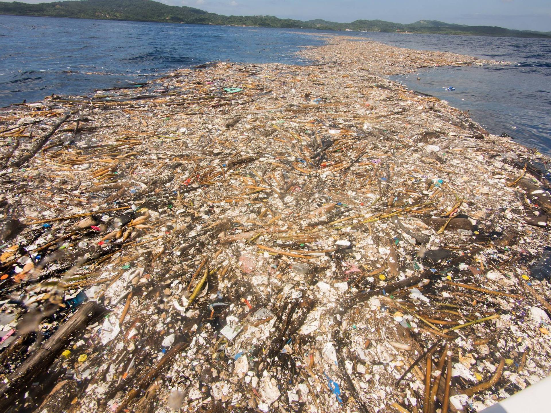 Plastic waste floats off the coast of Roatan, Honduras on September 7, 2017.