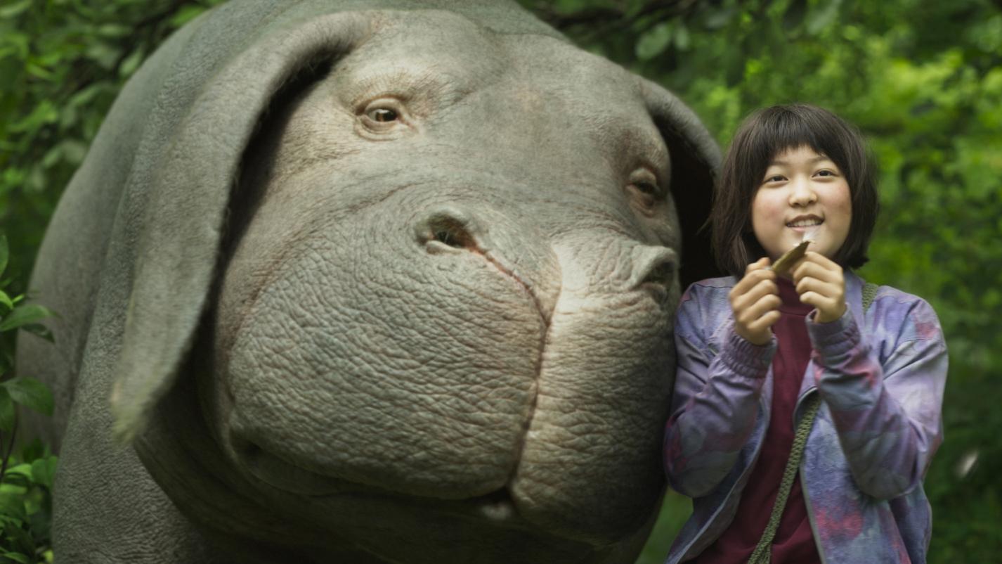 A scene from the movie "Okja," featuring the title creature — a humongous pet pig.