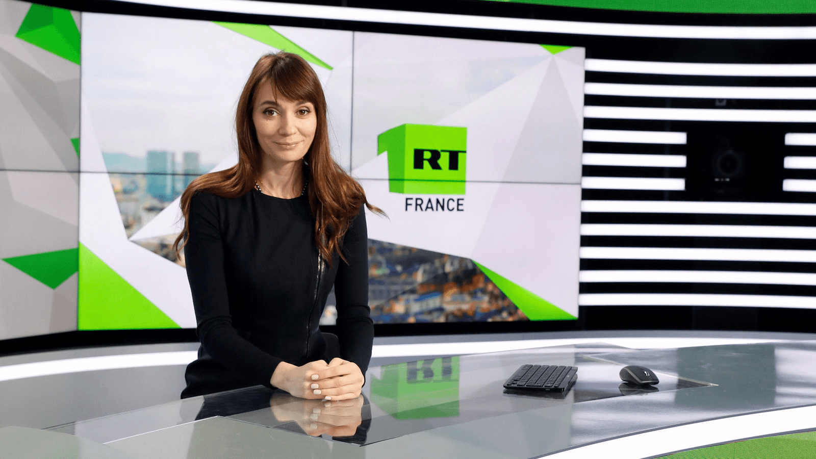 Xenia Fedorova, chief executive of RT France, of the Russian state broadcaster RT, formerly known as "Russia Today,” poses during a visit to their news studio in Boulogne-Billancourt, near Paris, France, Dec. 18, 2017.