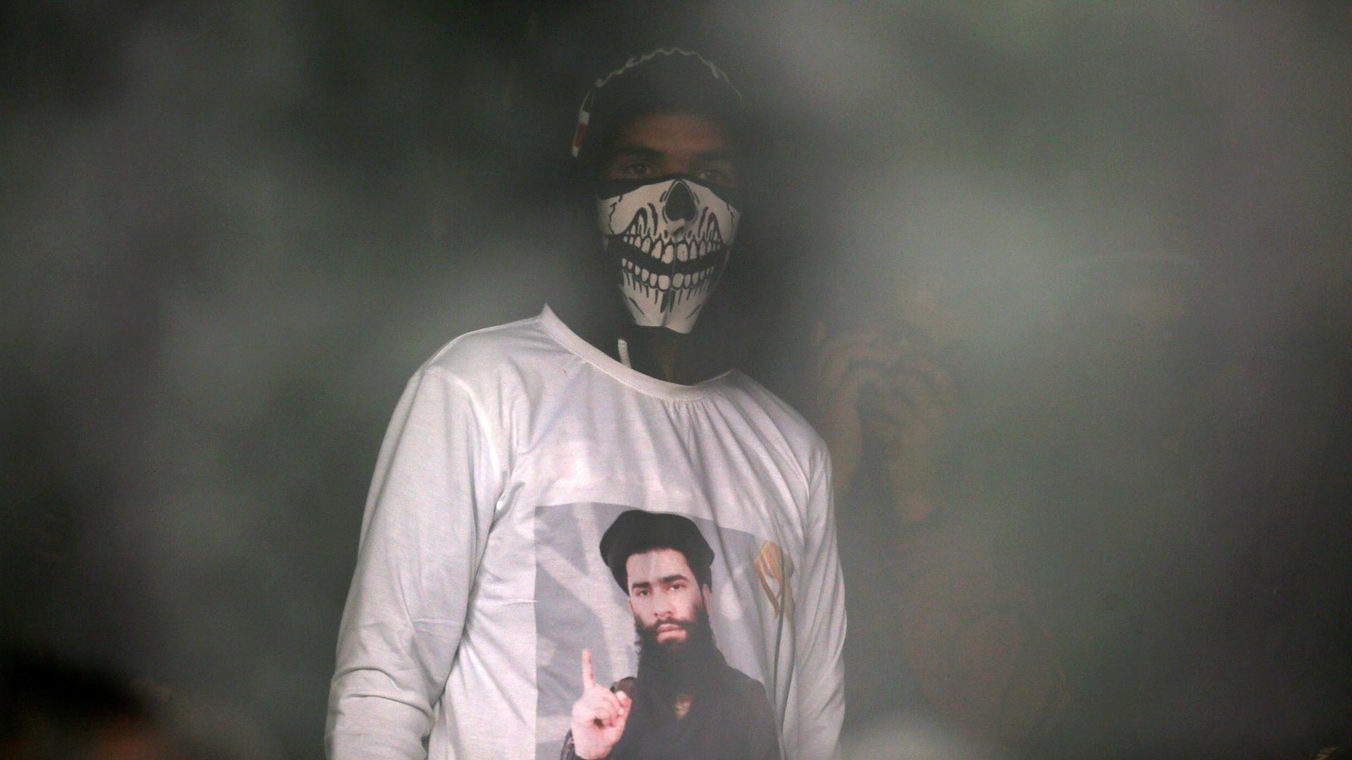 A man wearing a T-shirt with an image of Zakir Rashid Bhat in India's Kashmir region