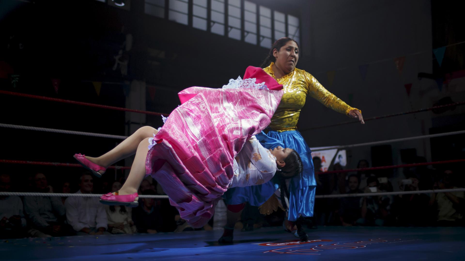two Bolivian women square off in a wrestling ring