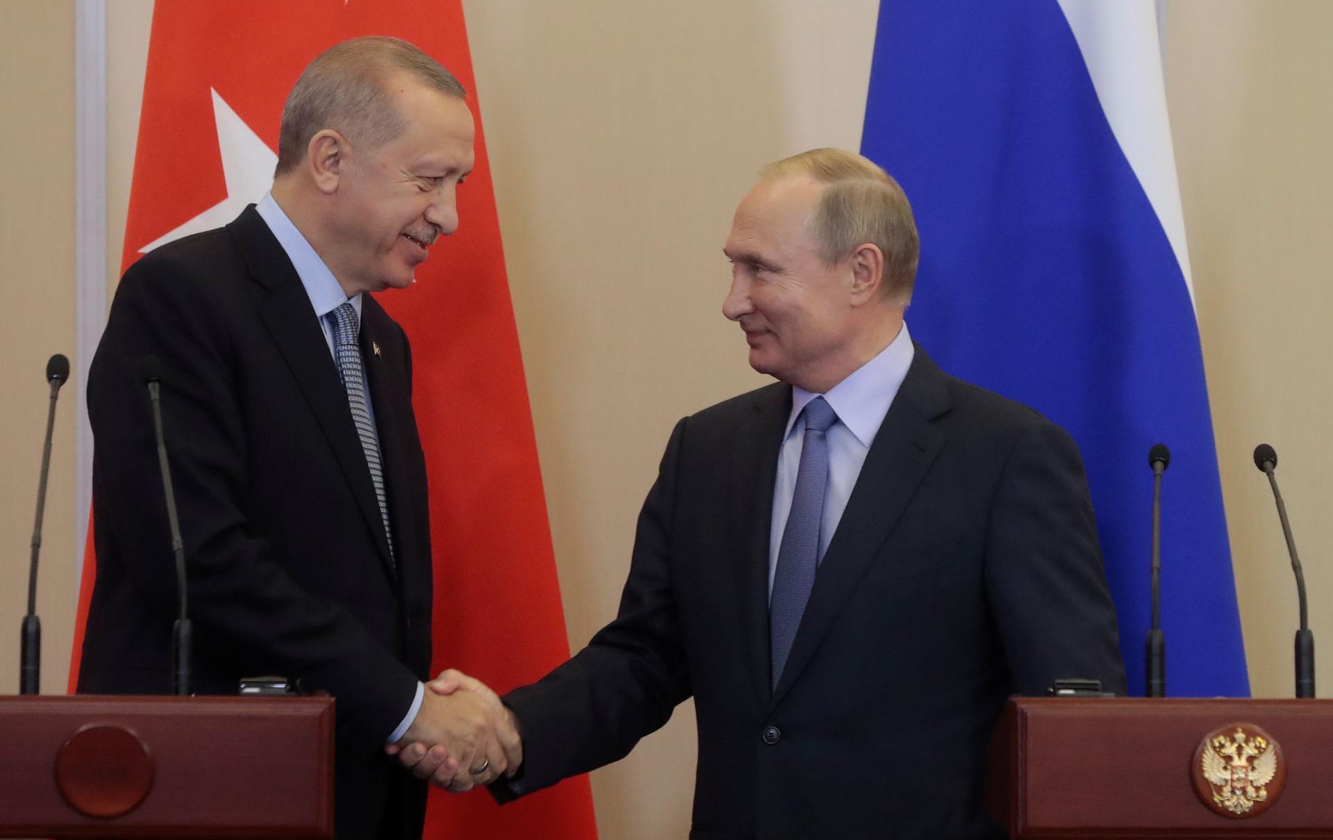 Russian President Vladimir Putin, right, shakes hands with Turkish President Recep Tayyip Erdogan, left, during their joint news conference following Russian-Turkish talks in the Black sea resort of Sochi, Russia, on October 22, 2019.