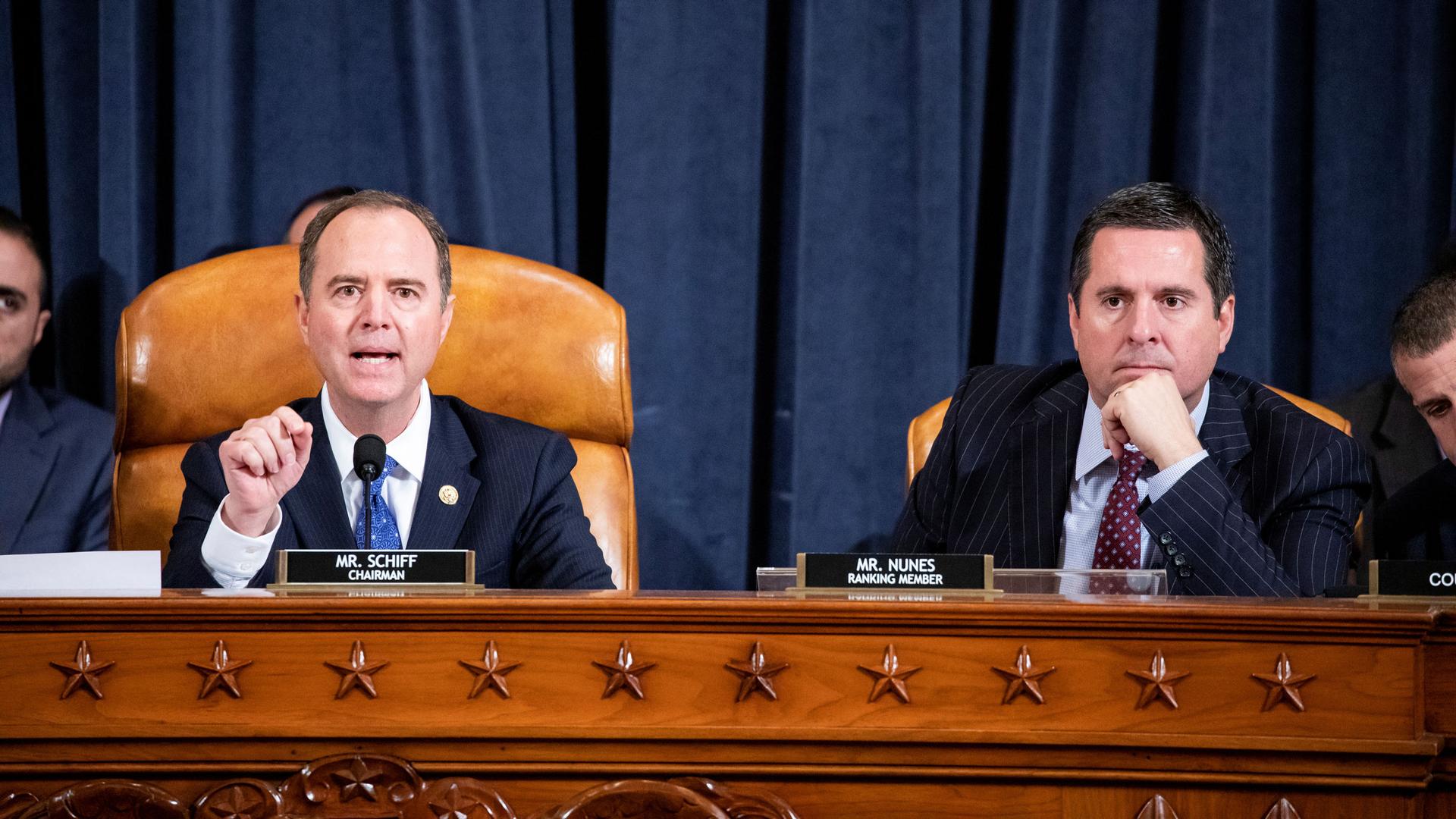 House Intelligence Committee Chairman Adam Schiff (D-CA) gives his closing remarks while House Intelligence Committee Ranking Member Devin Nunes (R-CA) listens.