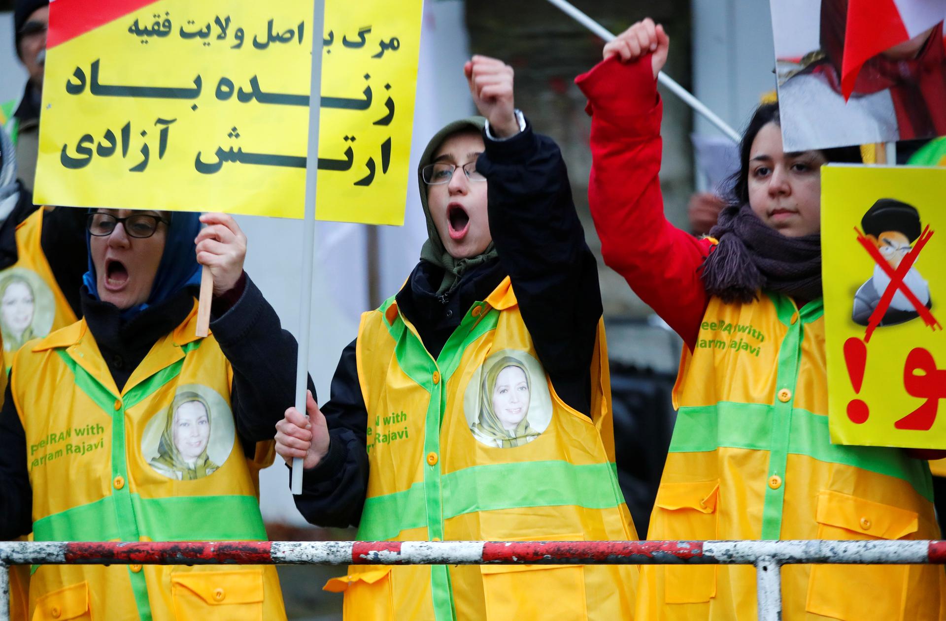 People attend a protest organized by National Council of Resistance of Iran in Germany to support nationwide demonstrations in Iran against the rise in gasoline prices, in Berlin, Germany.