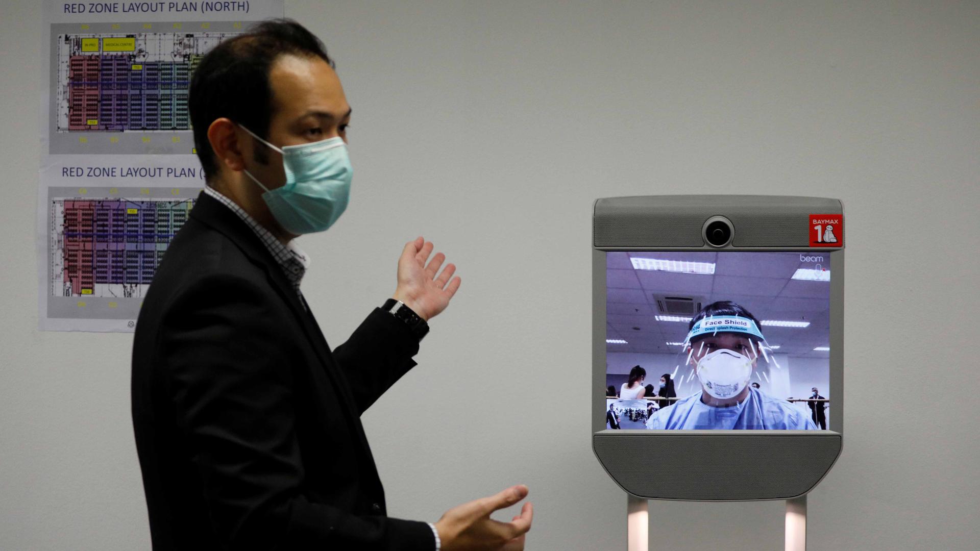 A "telepresence" robot which provides face-to-face medical consultation is pictured at Changi Exhibition Centre which has been repurposed into a community isolation facility that will house recovering or early COVID-19 patients with mild symptoms.
