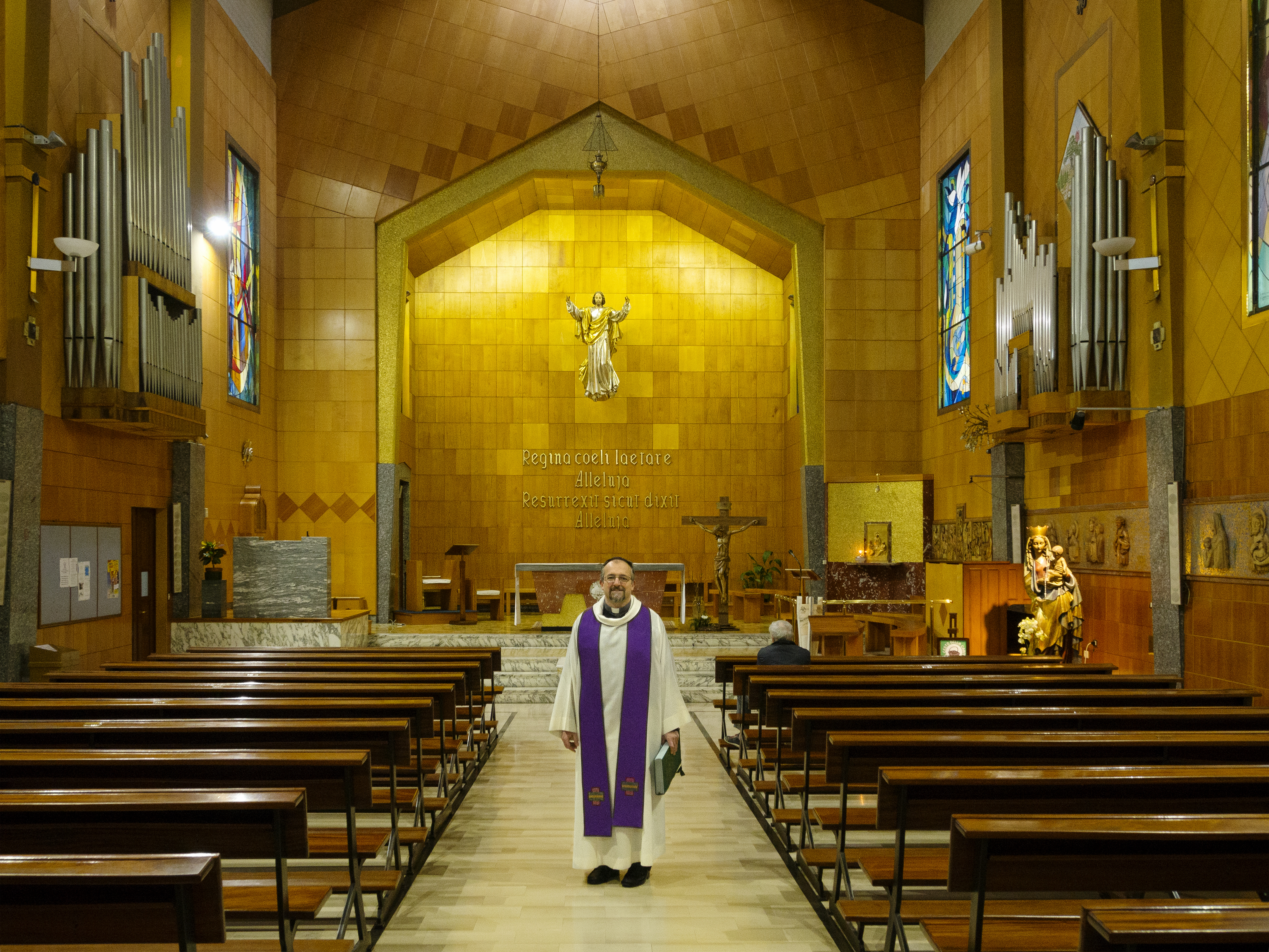 Rev. Luca Peyron is shown in his church in Turin. 