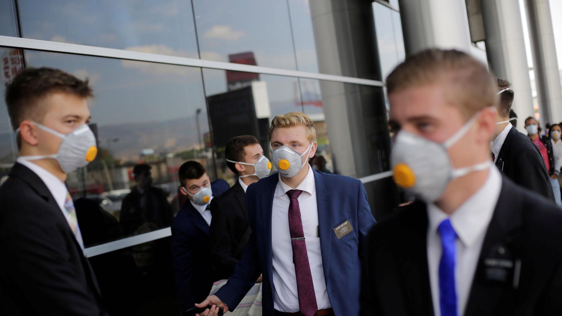 US members of The Church of Jesus Christ of Latter-day Saints, wearing protective masks, gather at Toncontin International airport before heading home, as the coronavirus disease (COVID-19) outbreak continues, in Tegucigalpa, Honduras, March 29, 2020.