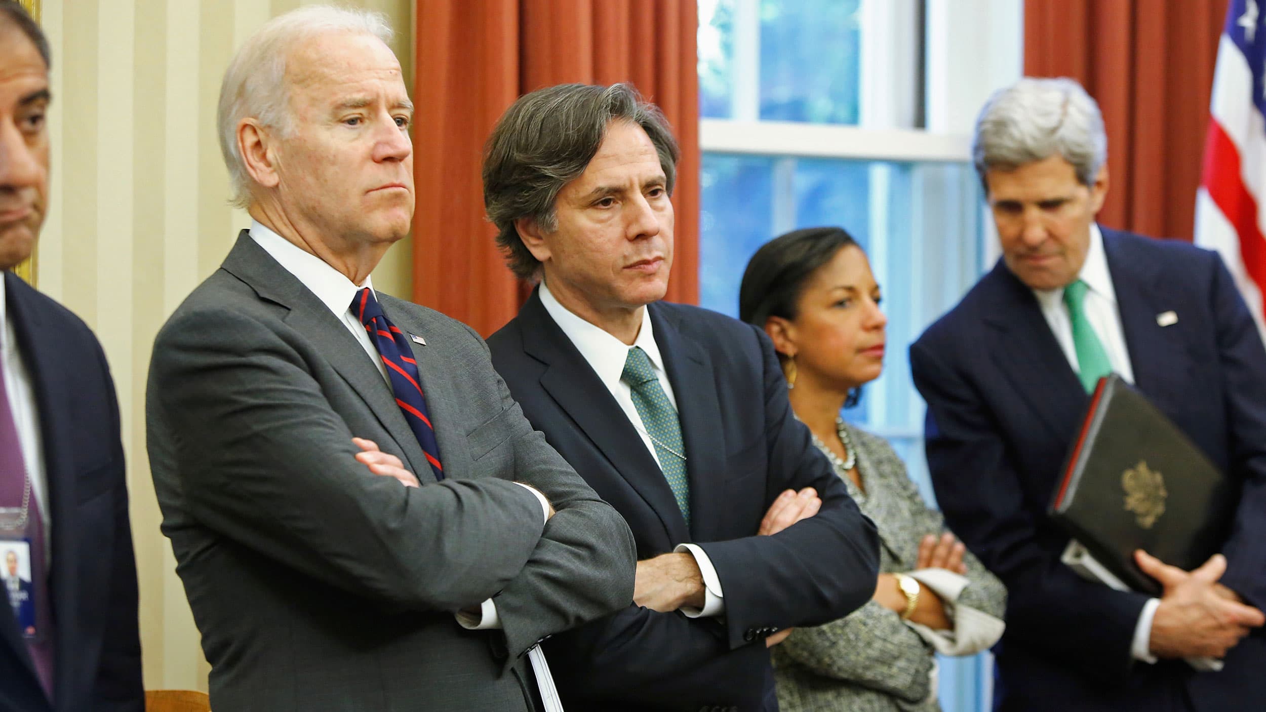 Vice President Joe Biden is shown with his arms folded next to then-Deputy National Security Adviser Tony Blinken in the Oval Office.