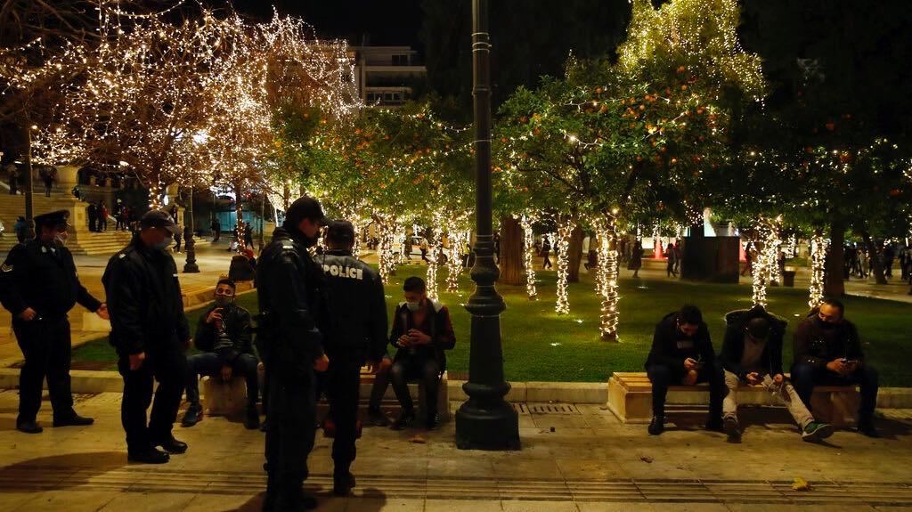 Police ask from people to leave Syntagma square due the measures against pandemic in central Athens, Dec. 24, 2020. Health officials warned that extra restrictions might be enforced over New Year if Greeks fail to respect Christmas restrictions as Greece