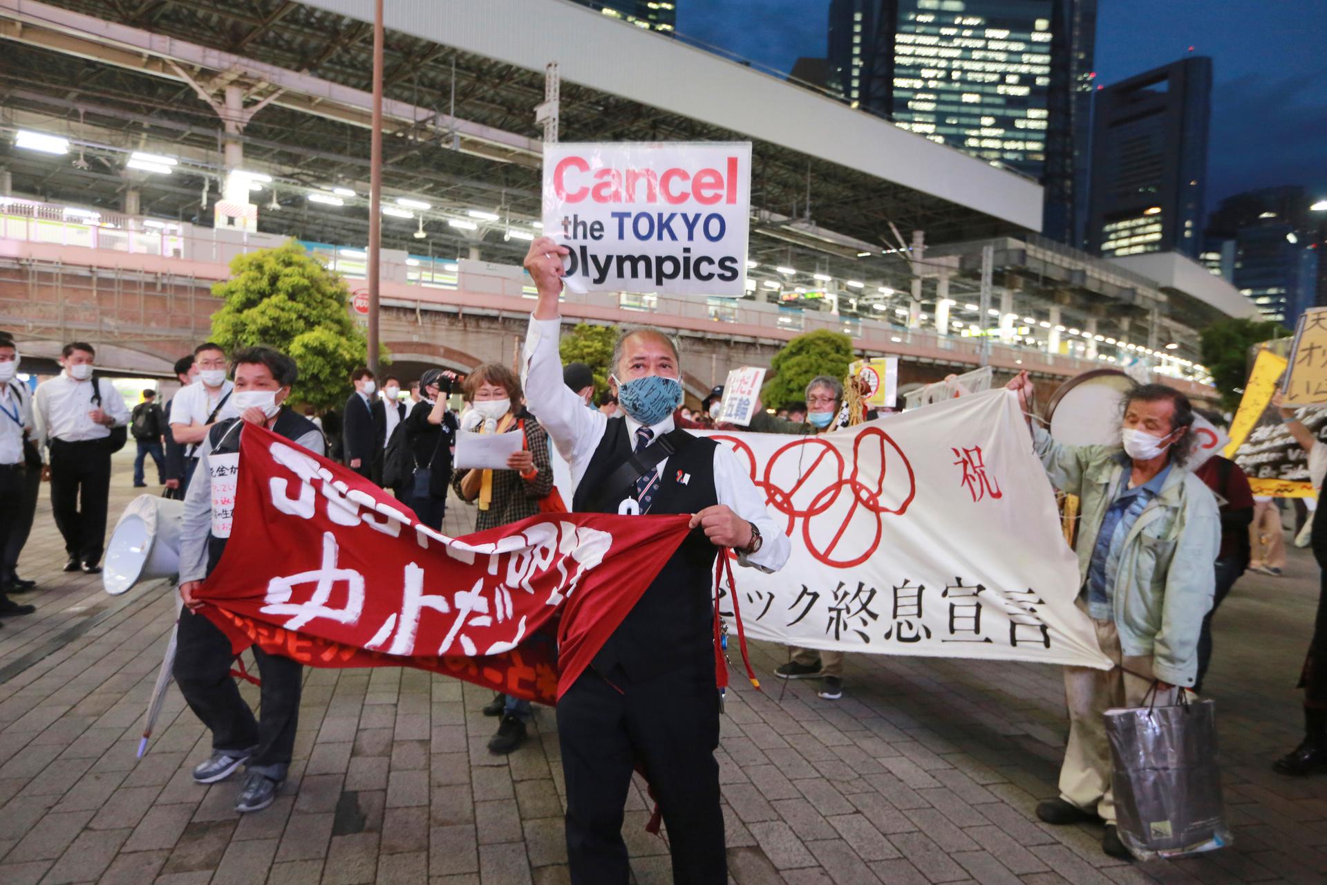 In this May 17, 2021, demonstrators protest against the Tokyo 2020 Olympics in Tokyo. The IOC and Tokyo Olympic organizers run into some of the strongest medical-community opposition so far with the games set to open in just over eight weeks. 