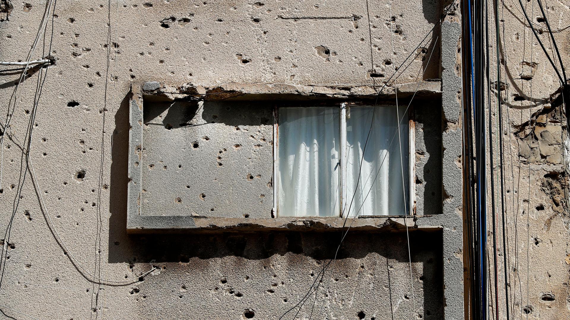 A building is still riddled with war damage, on the former frontline of the Lebanese Civil War, in Beirut, Lebanon, Tuesday, April 13, 2021.
