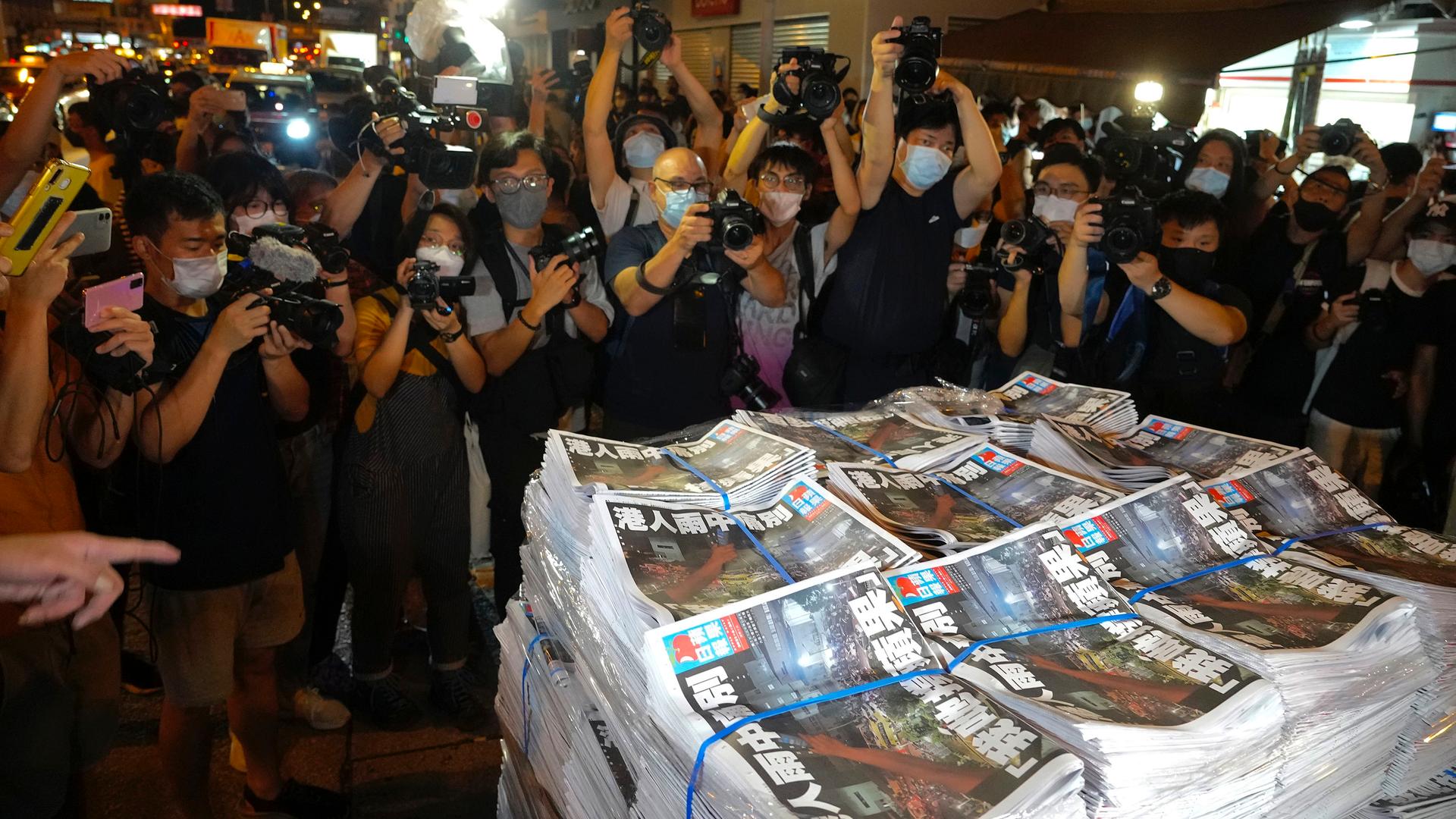 Last issue of Apple Daily arrive at a newspaper booth in Hong Kong, early Thursday, June 24, 2021.