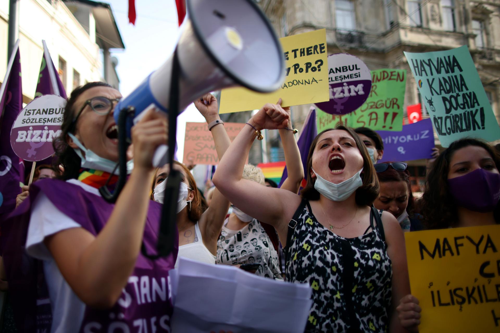 People chant slogans during a protest against the government's decision to withdraw from Istanbul Convention, in Istanbul, Thursday, July 1, 2021.