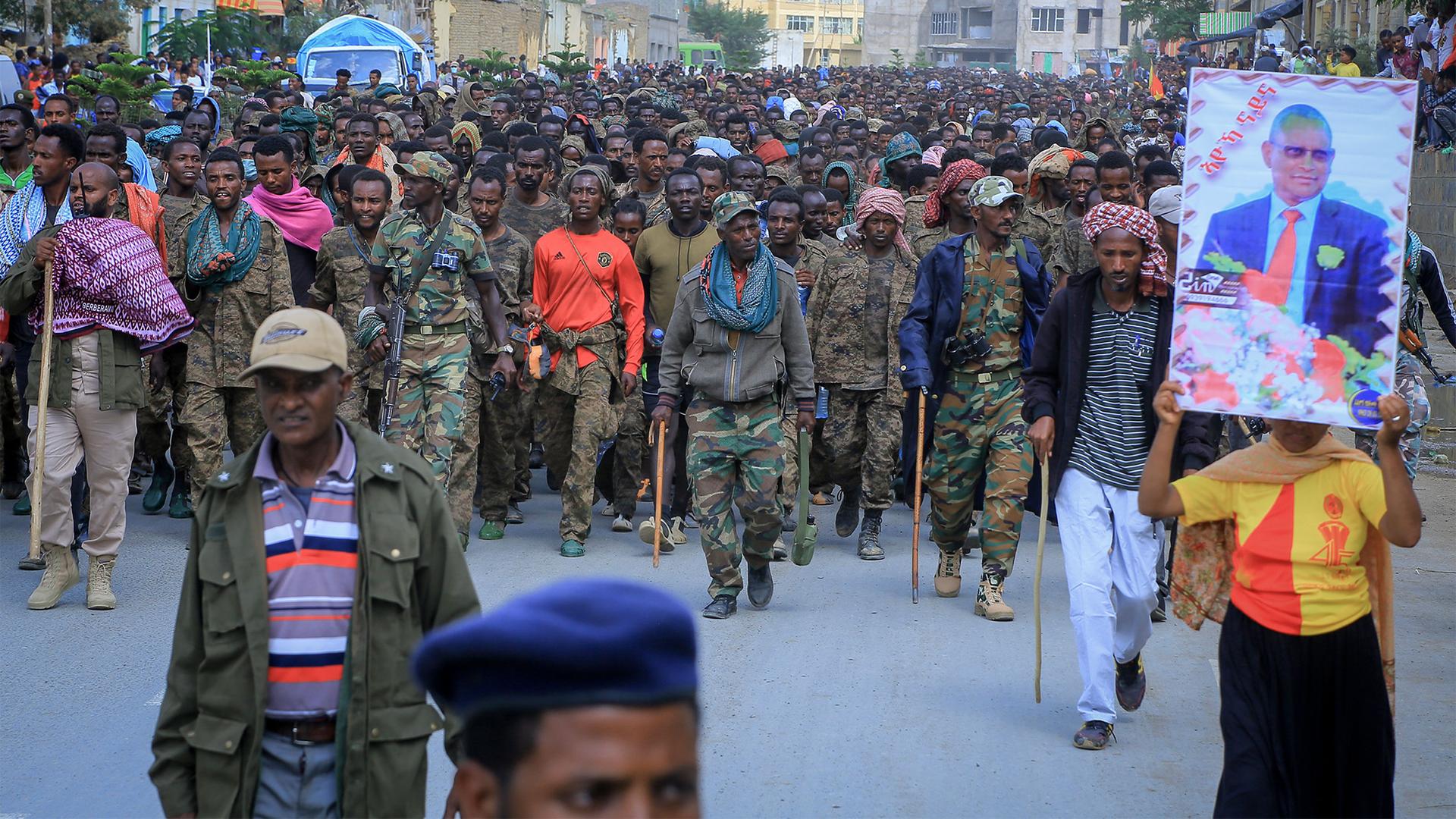 Captured members of the Ethiopian National Defense Force are marched through the streets to prison under guard by Tigray Forces