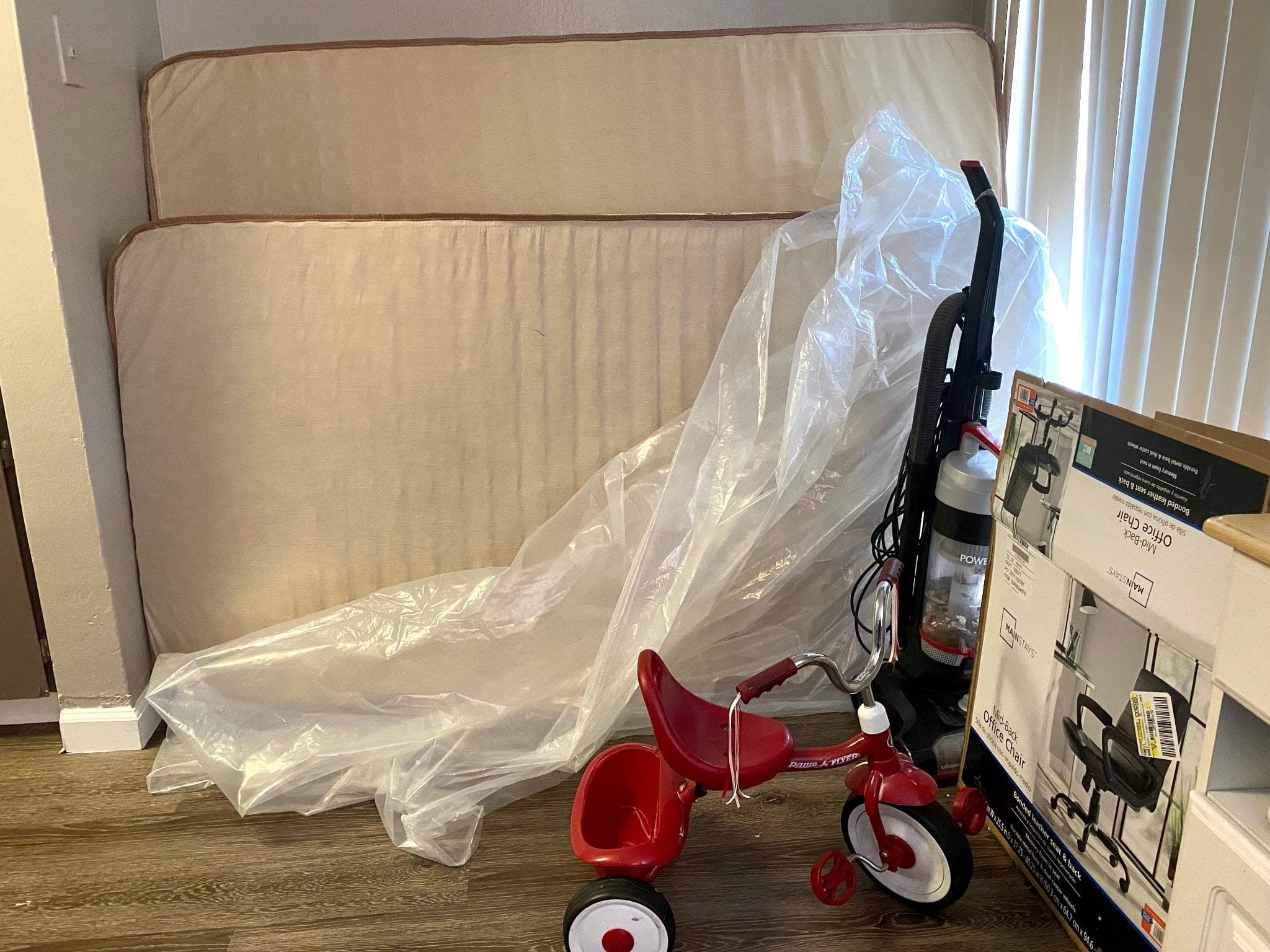 Donated mattress and a tricycle are among the items slowly arriving at a newly arrived Afghan family’s apartment in Sacramento, California.