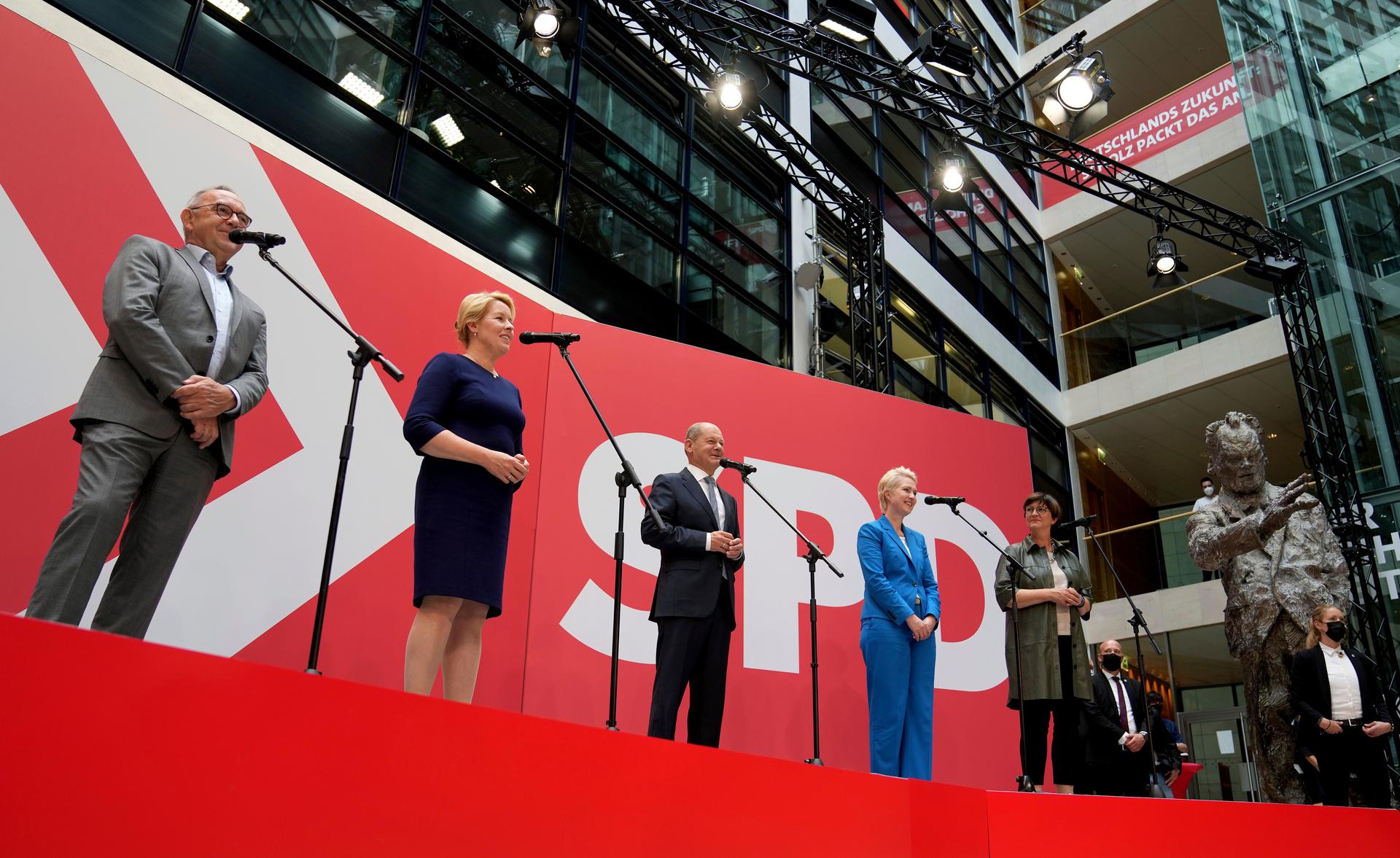 Olaf Scholz, center, top candidate for chancellor of the Social Democratic Party (SPD), speaks during a press conference at the party's headquarters in Berlin, Germany