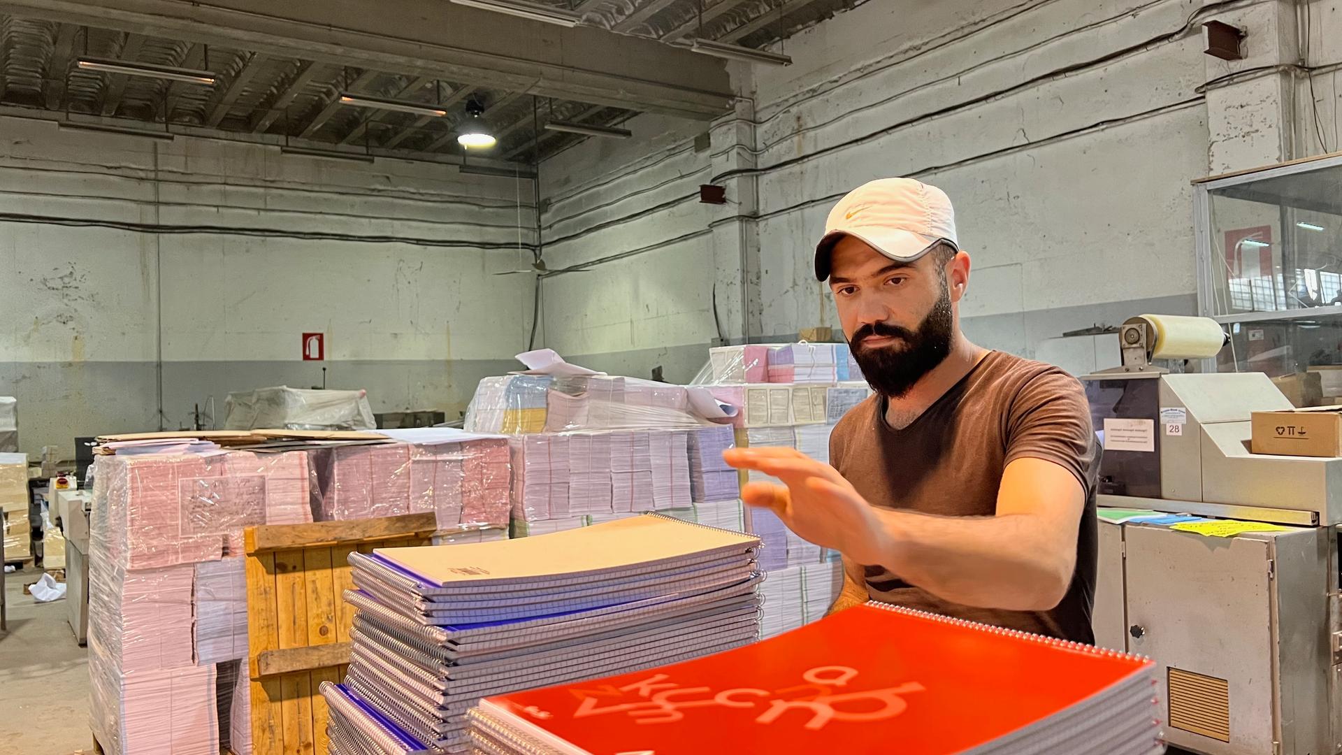 Twenty-four-year-old Abdel Ghani Ali Ghanoum works at a paper factory on the outskirts of Beirut. The economic crisis in Lebanon and the recent Saudi ban on Lebanese imported goods means he faces an uncertain future. He is considering taking a boat to Tur