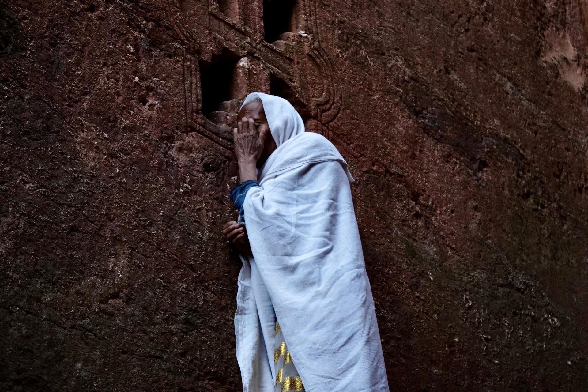 Woman praying at the 13th-century rock churches of Lalibela, Ethiopia, Feb. 16, 2022.