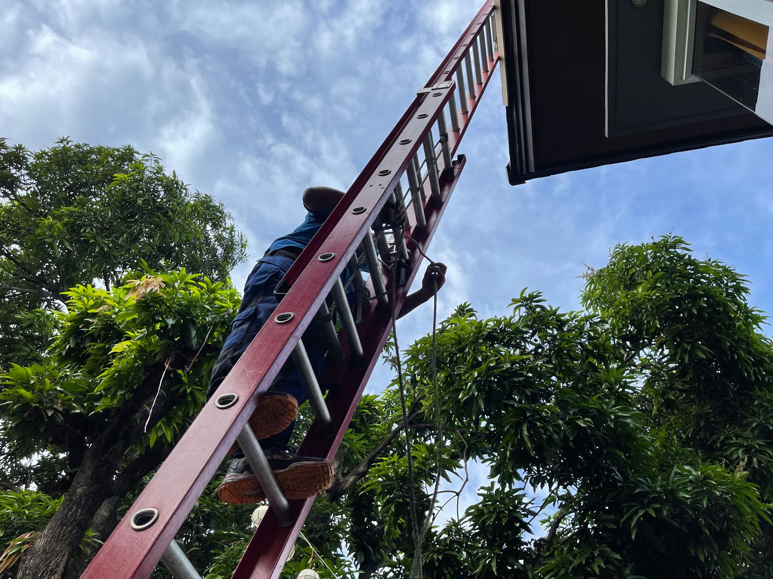 Workers install solar equipment with Philergy, a German-Filipino solar company.
