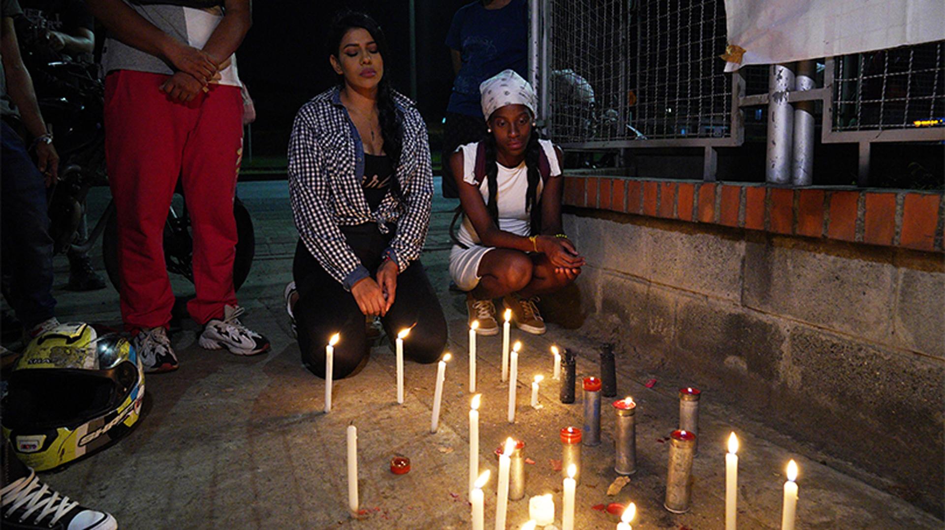 Friends and family of Nicolas Guerrero lit candles near the spot where he was killed during a protest
