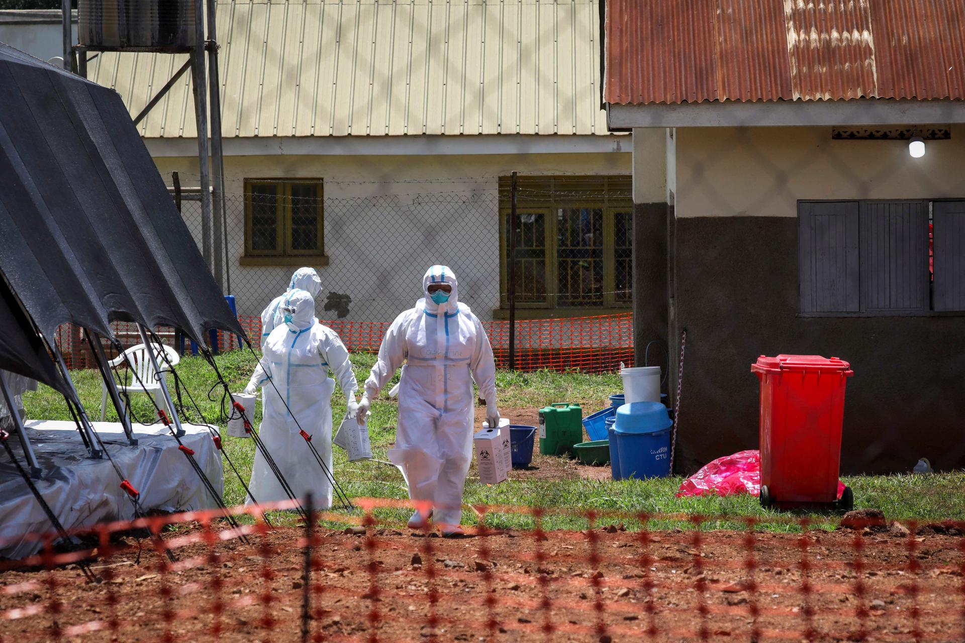 workers in hazmat suits