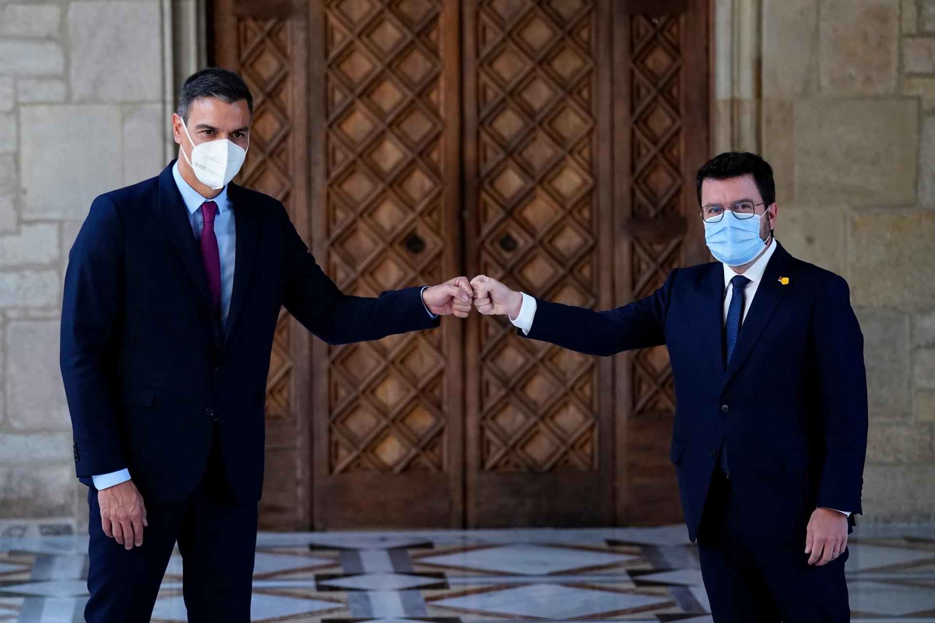 Spanish Prime Minister Pedro Sanchez and Catalonian regional president Pere Aragonès, right, meet at the headquarter of the Government of Catalonia in Barcelona, Spain, Wednesday, Sept. 15, 2021.