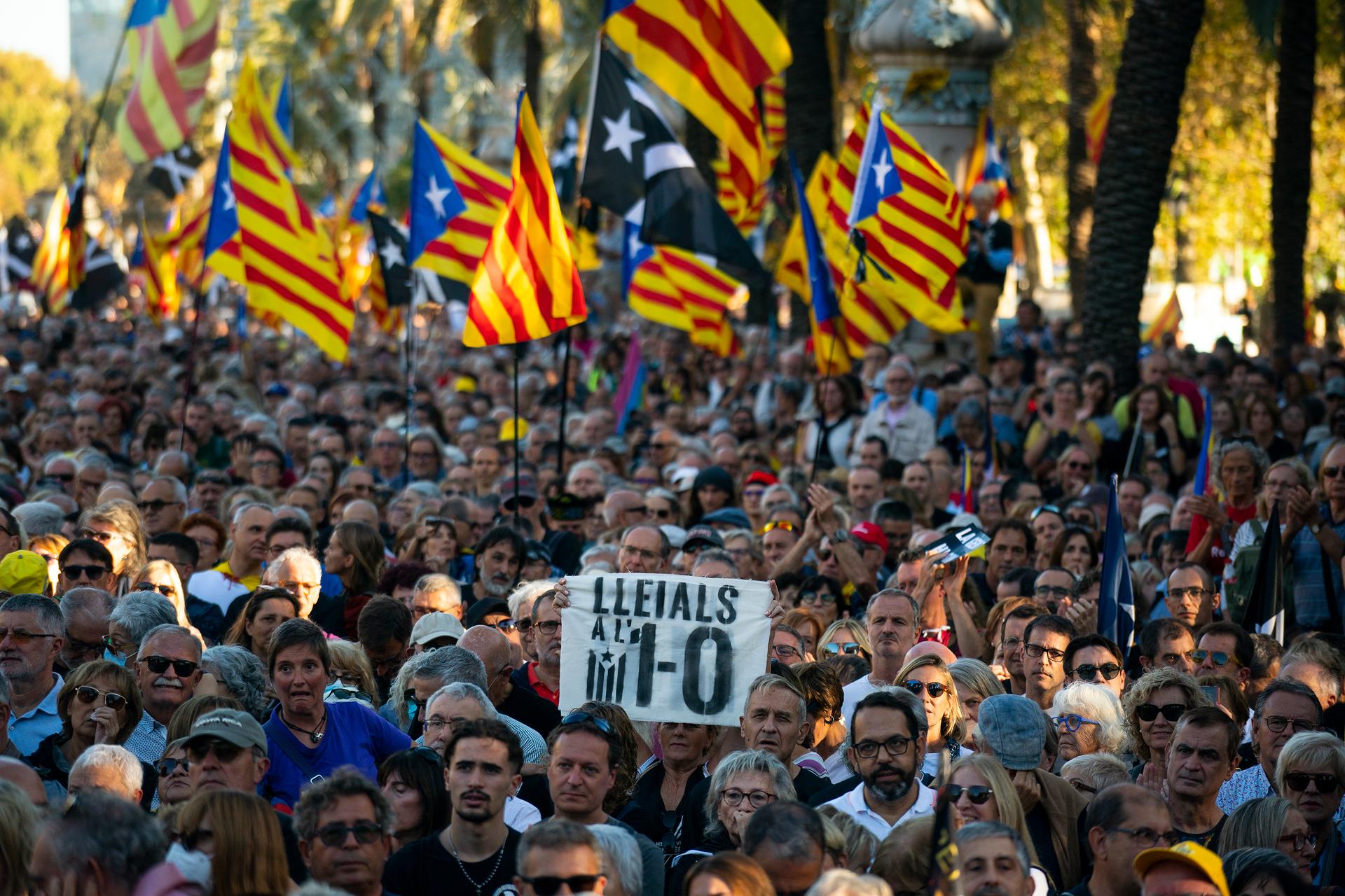 Protesters hold ''esteladas'' or Catalonia independence flag as they take part in a demonstration to commemorate the fifth anniversary of an independence referendum that marked the high point of their movement to break away from the rest of Spain, in Barc