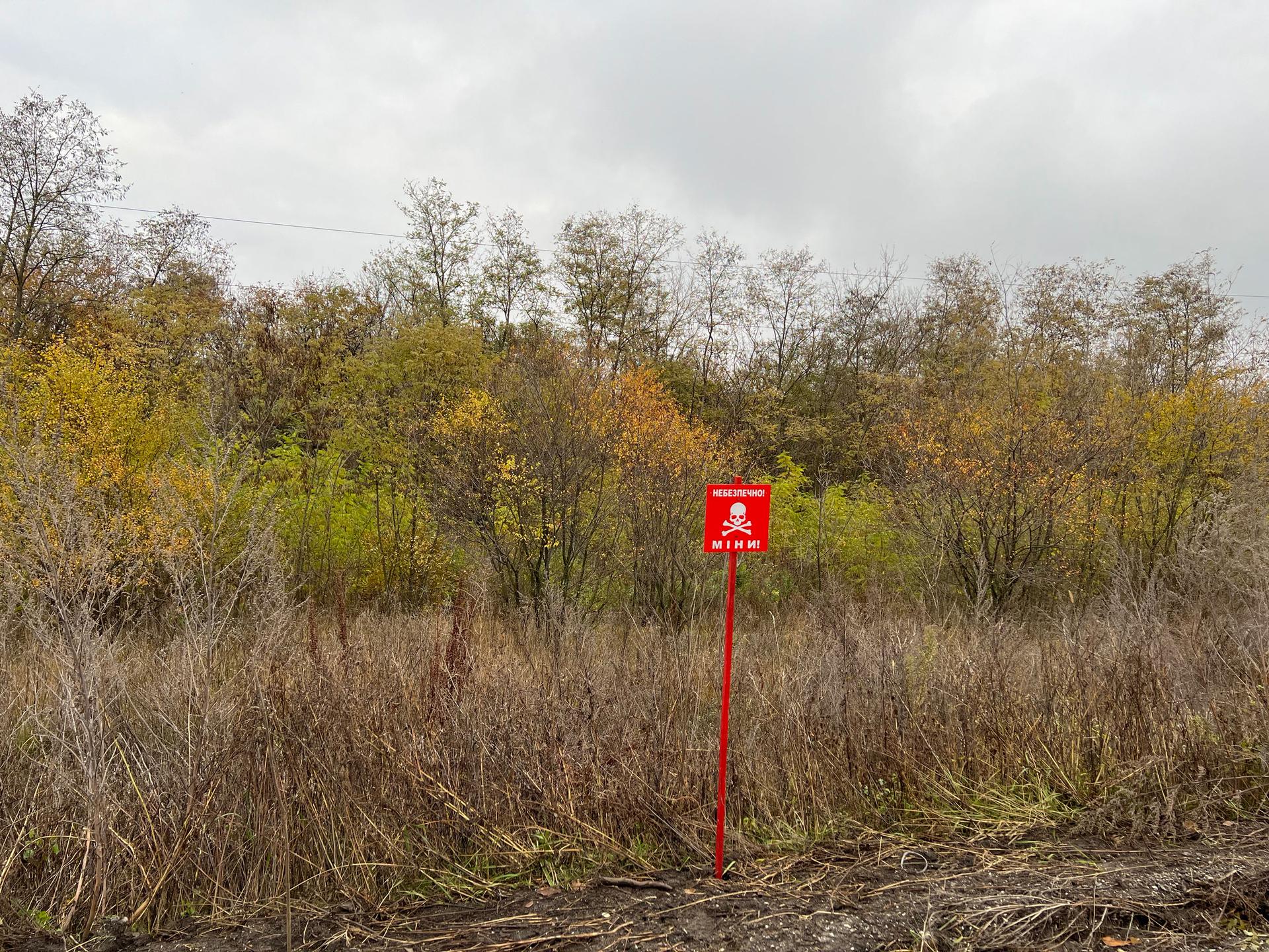 Signs warn of mines left behind by the Russian forces.