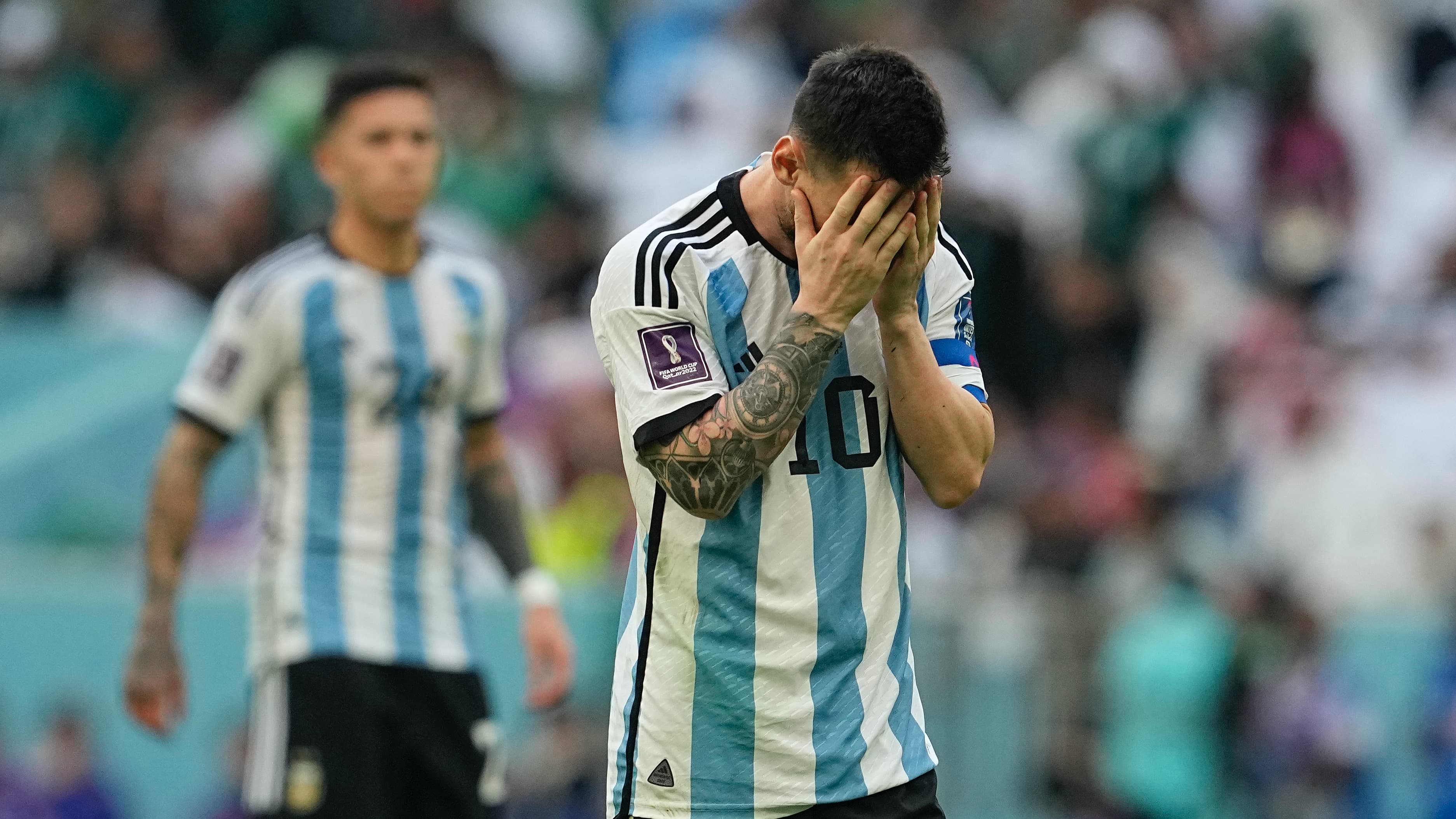 soccer player with head in his hands