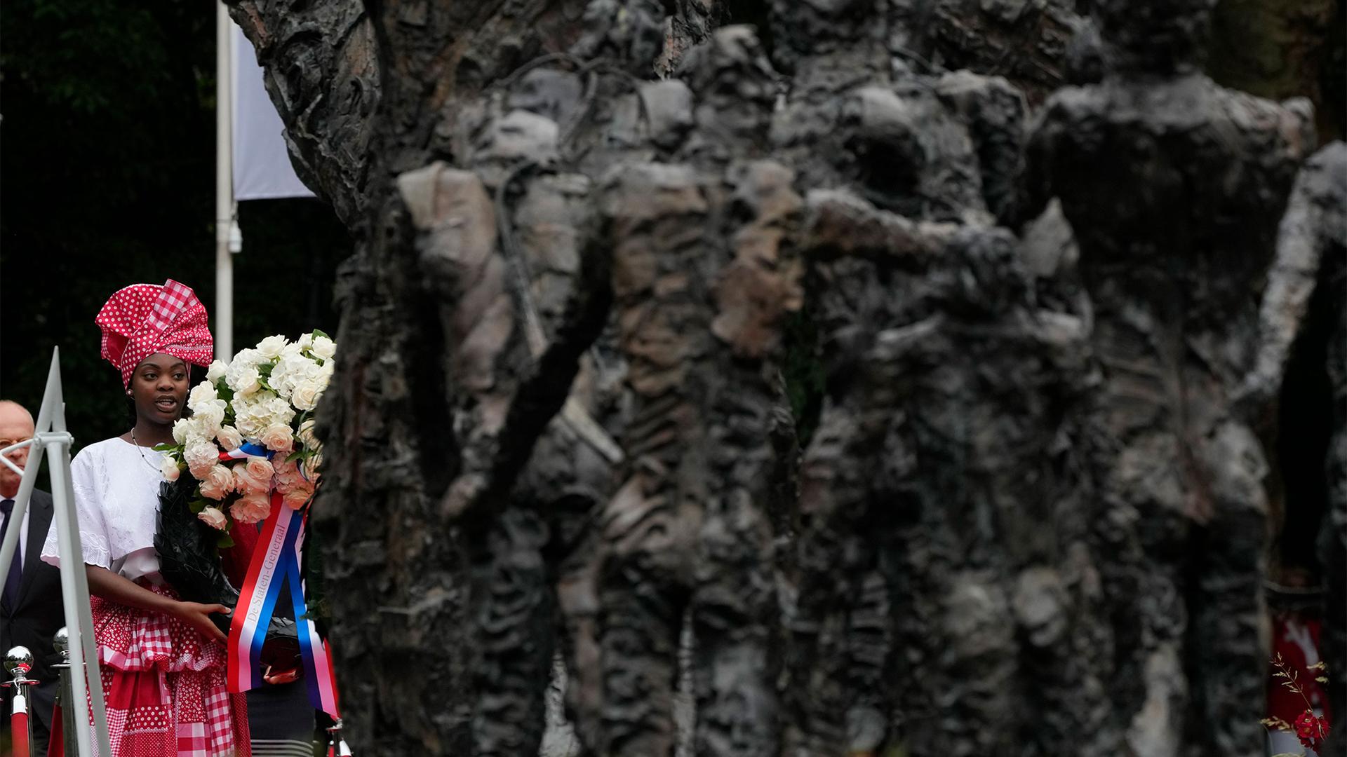 Wreath laying at the National Slavery Monument after Amsterdam Mayor Femke Halsema apologized for the involvement of the city's rulers in the slave trade during a nationally televised annual ceremony in Amsterdam, Netherlands, July 1, 2021.