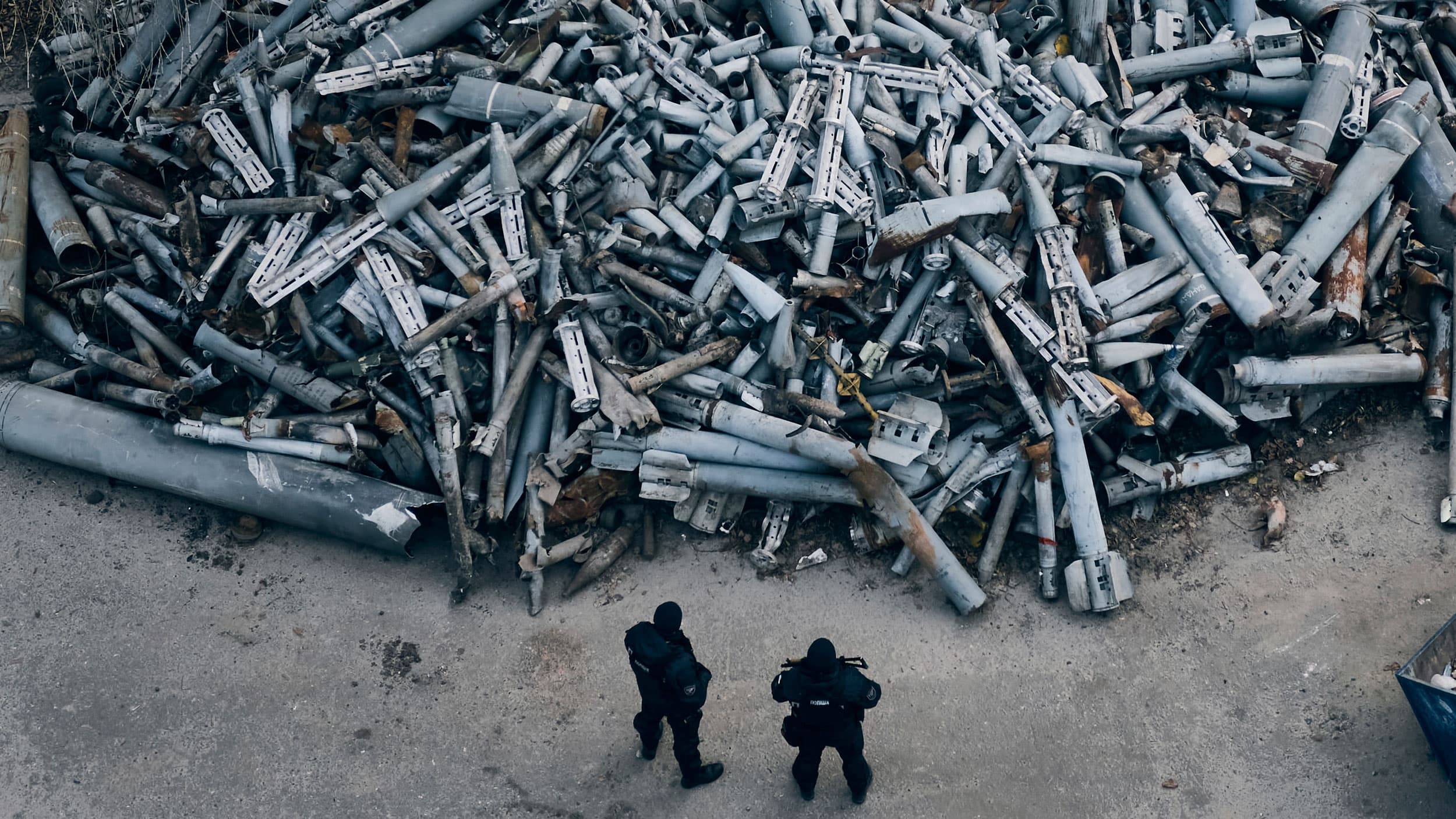 Police officers look at collected fragments of the Russian rockets that hit Kharkiv, in Kharkiv, Ukraine, Saturday, Dec. 3, 2022. 