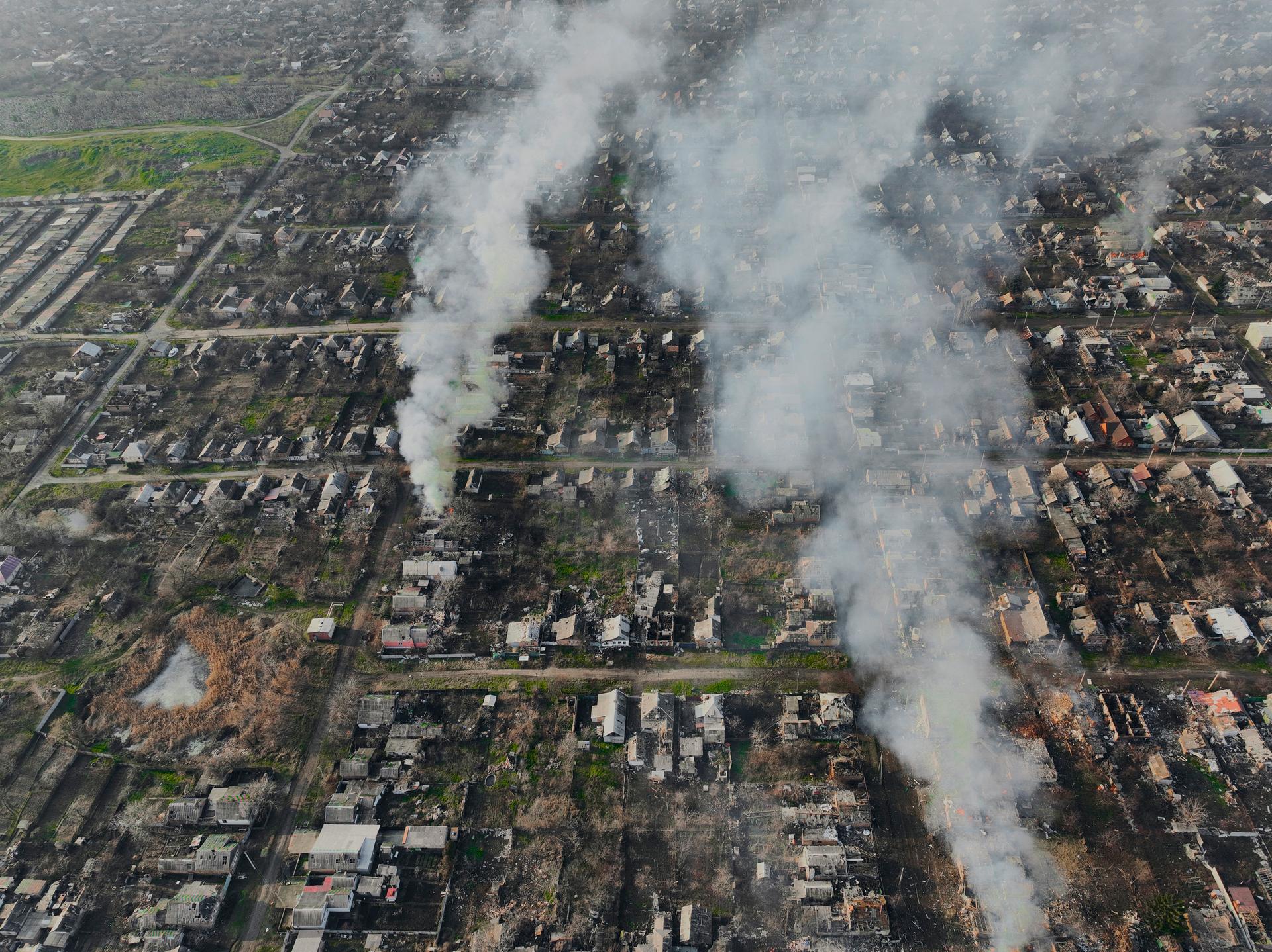 smoke rises over the landscape