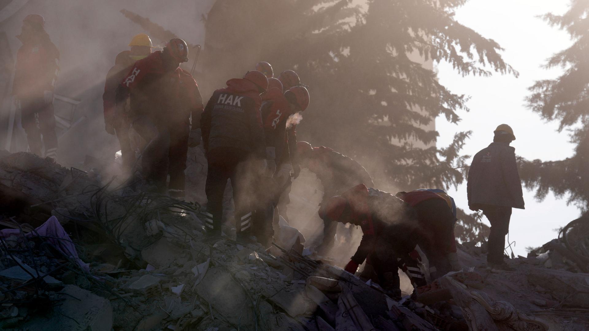 Rescuers search in a destroyed building in Gaziantep, southeastern Turkey, Thursday, Feb. 9, 2023. 