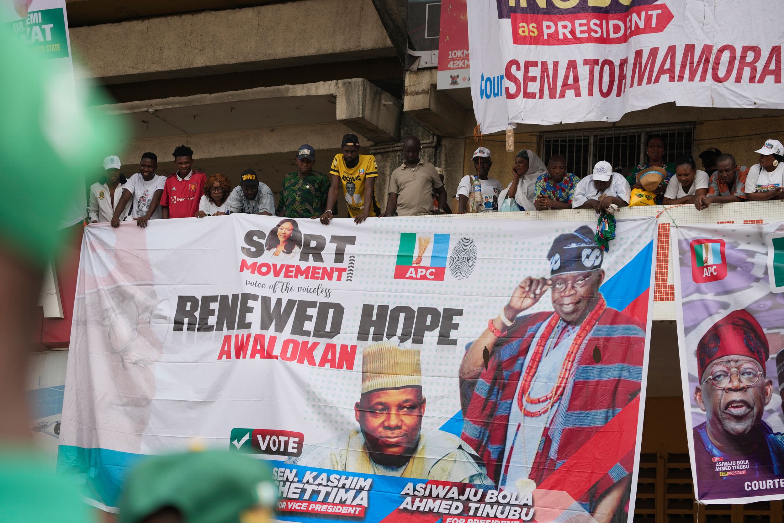 Supporters of Bola Ahmed Tinubu, the presidential candidate of the All Progressives Congress, stand on a balcony during an election campaign rally at the Teslim Balogun Stadium in Lagos Nigeria, Tuesday, Feb. 21, 2023.