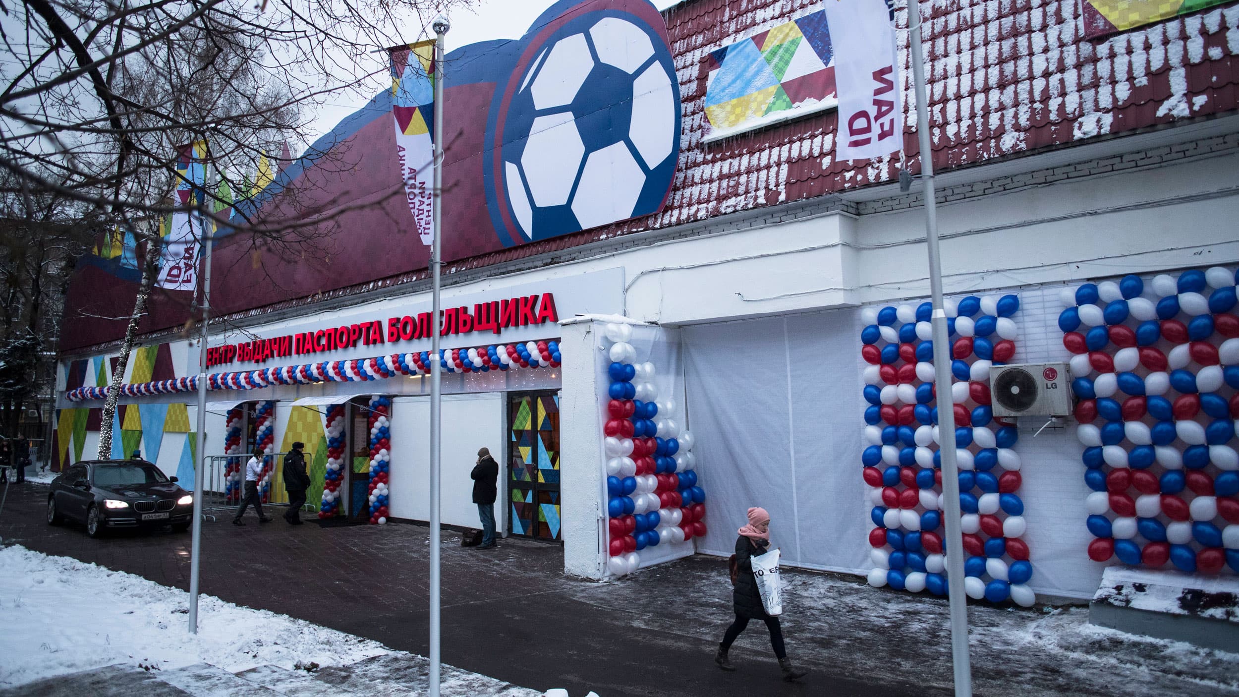 A woman walks past the WCup Fan ID distribution center as it's opened in Moscow, Russia, Thursday, Dec. 7, 2017.