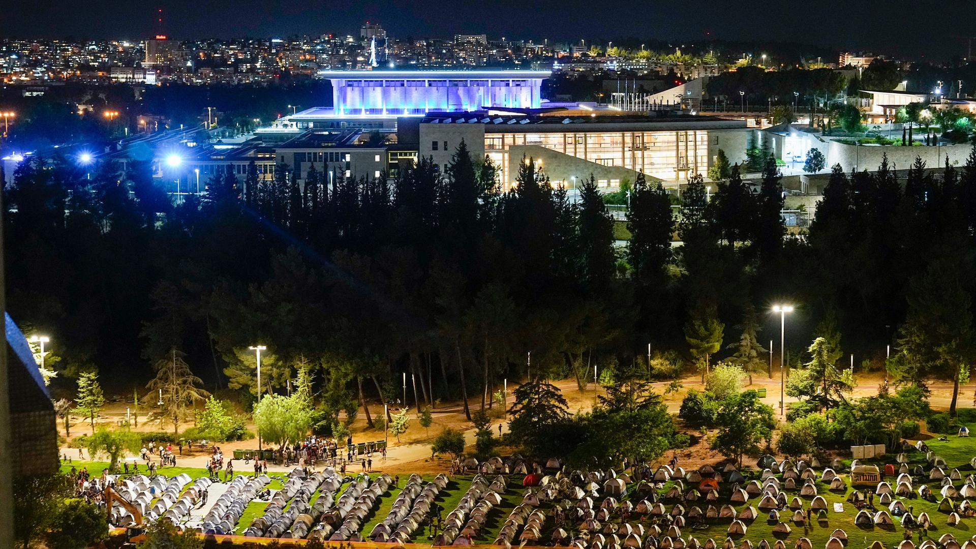 Marchers who completed the last leg of a four-day, 45-mile trek from Tel Aviv to Israel's parliament to protest Prime Minister Benjamin Netanyahu's plan to overhaul the country's judiciary set up camp outside the Knesset.