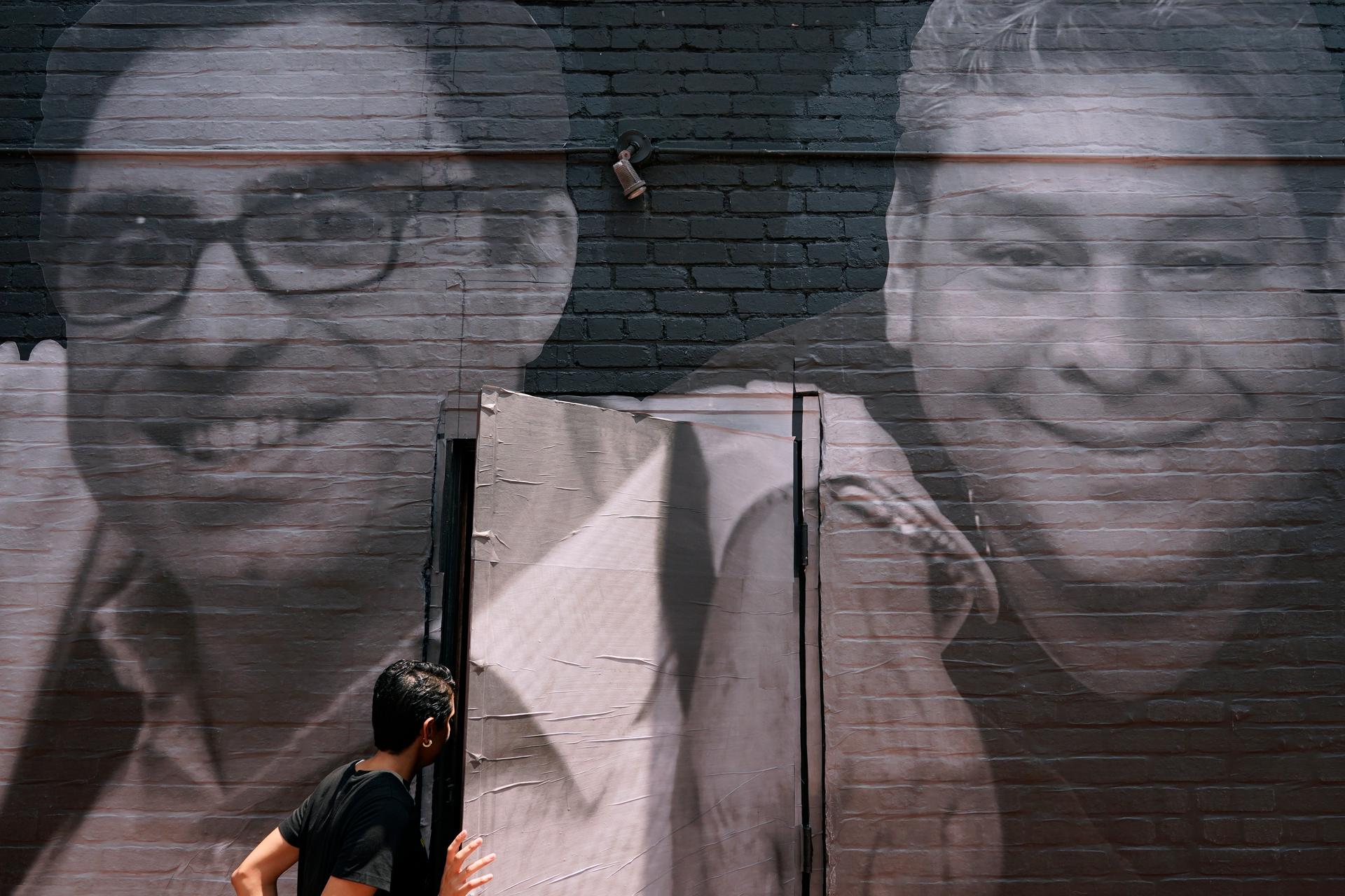 A mural depicts American hostages and wrongful detainees being held abroad, July 20, 2022, in the Georgetown neighborhood of Washington. At left is Siamak Namazi, who has been in captivity in Iran since 2015.