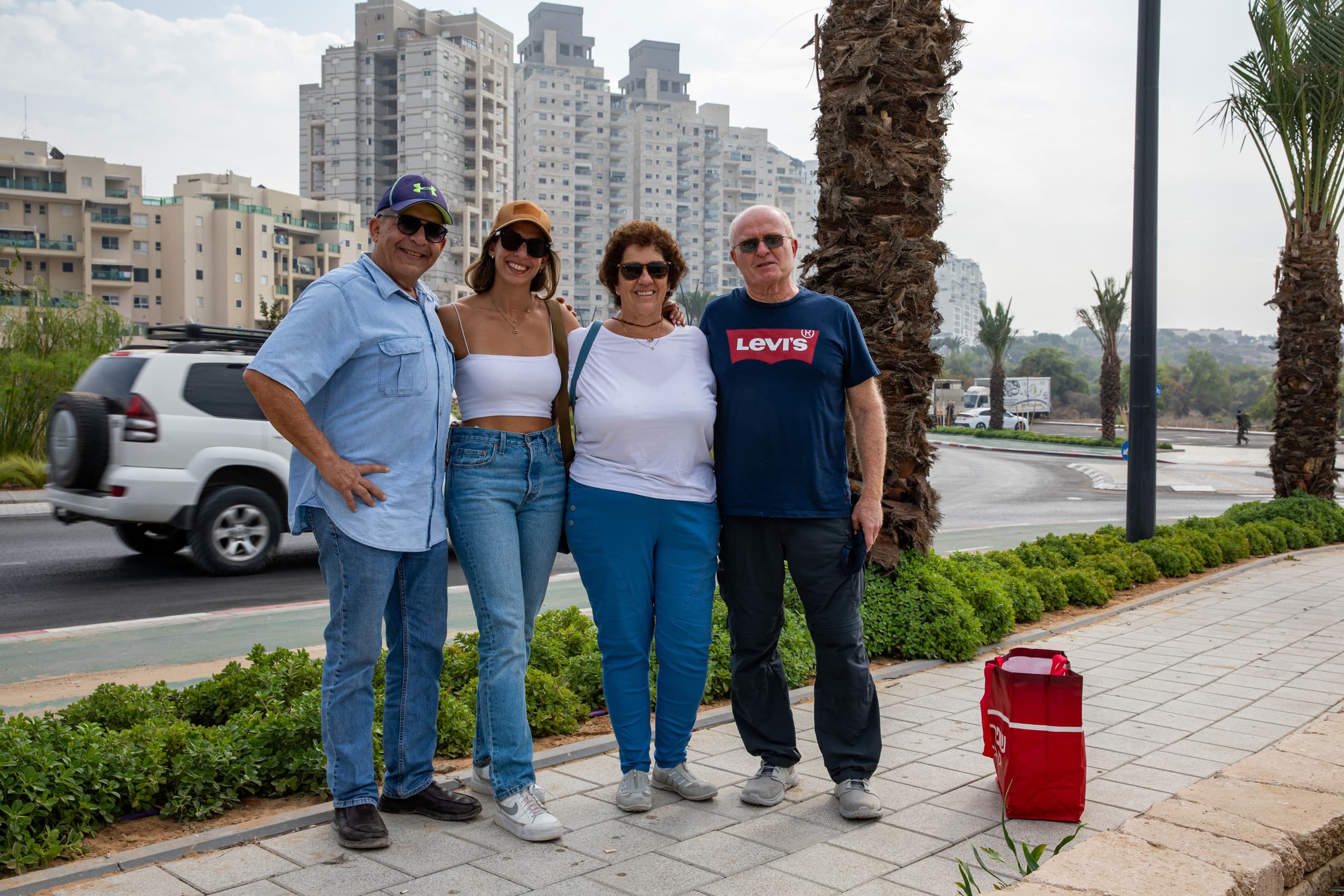 Suzi Eigenstein (wearing a white shirt) gathers to bring cookies for her son and his unit while serving in the Israeli military.