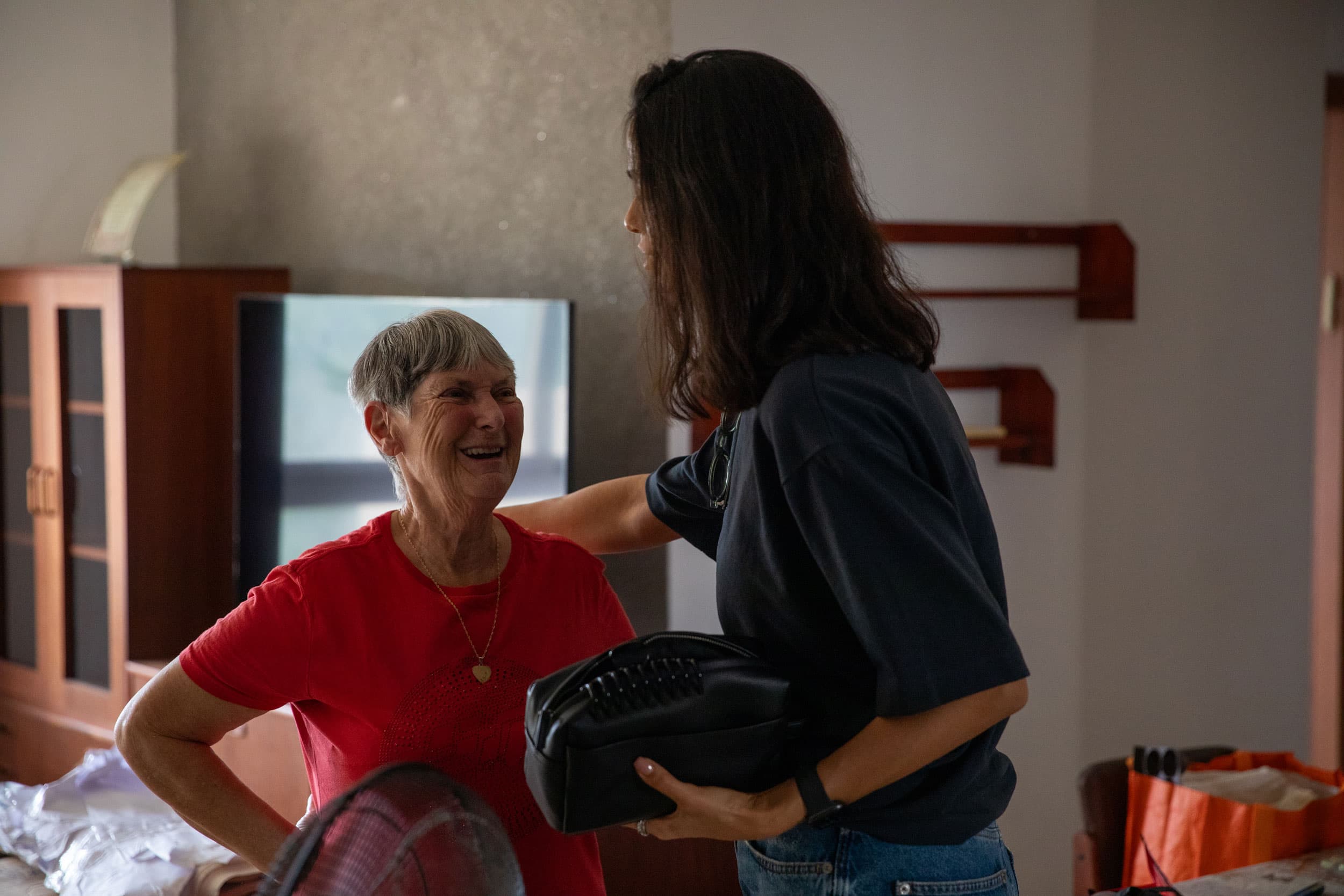 Rachel Rosenfeld (left) lives by herself in a big apartment complex in Ashkelon.
