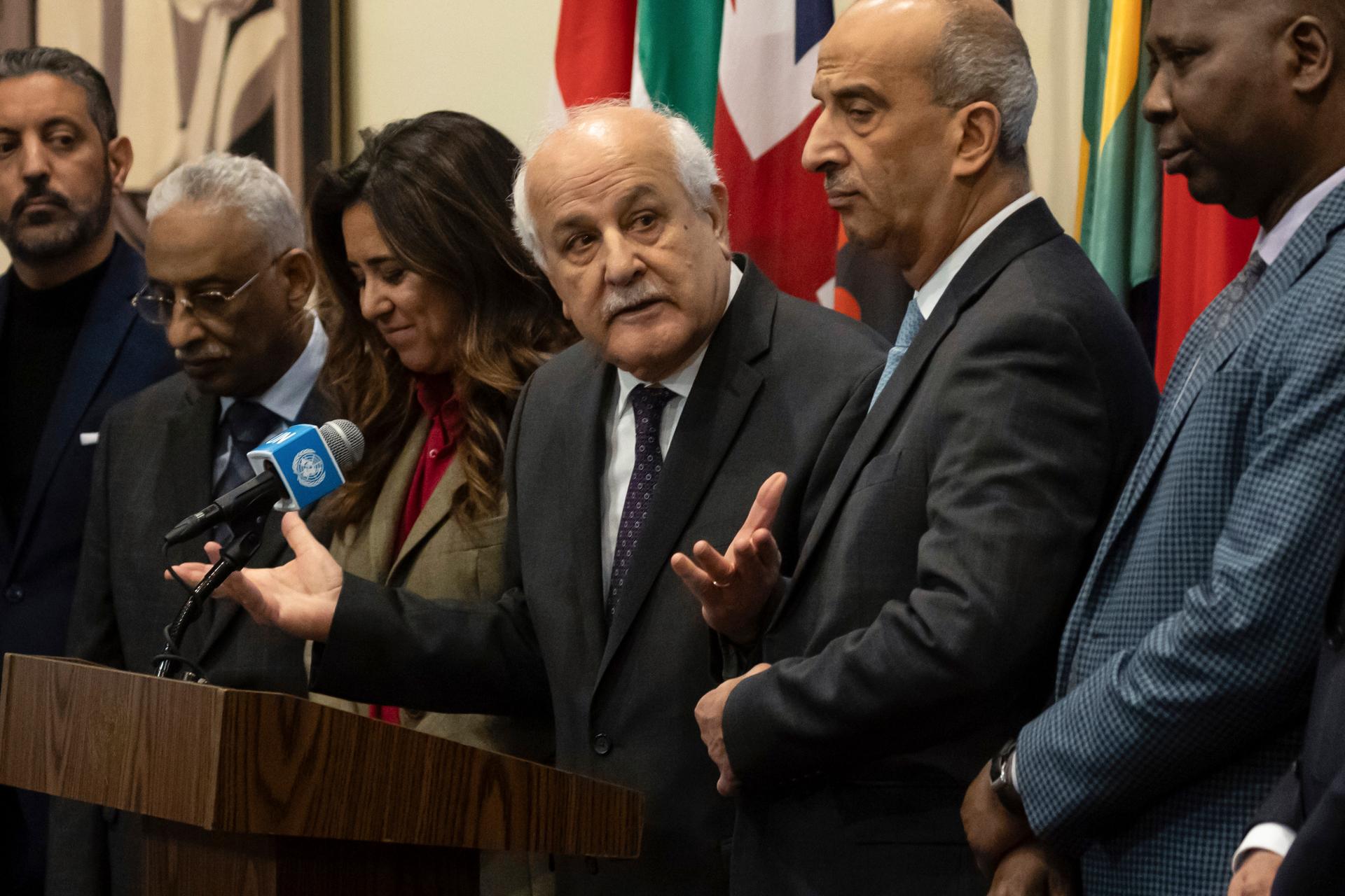 Palestinian Ambassador to the United Nations, Riyad Mansour, center, speaks during a press conference at United Nations headquarters, Dec. 22, 2023.