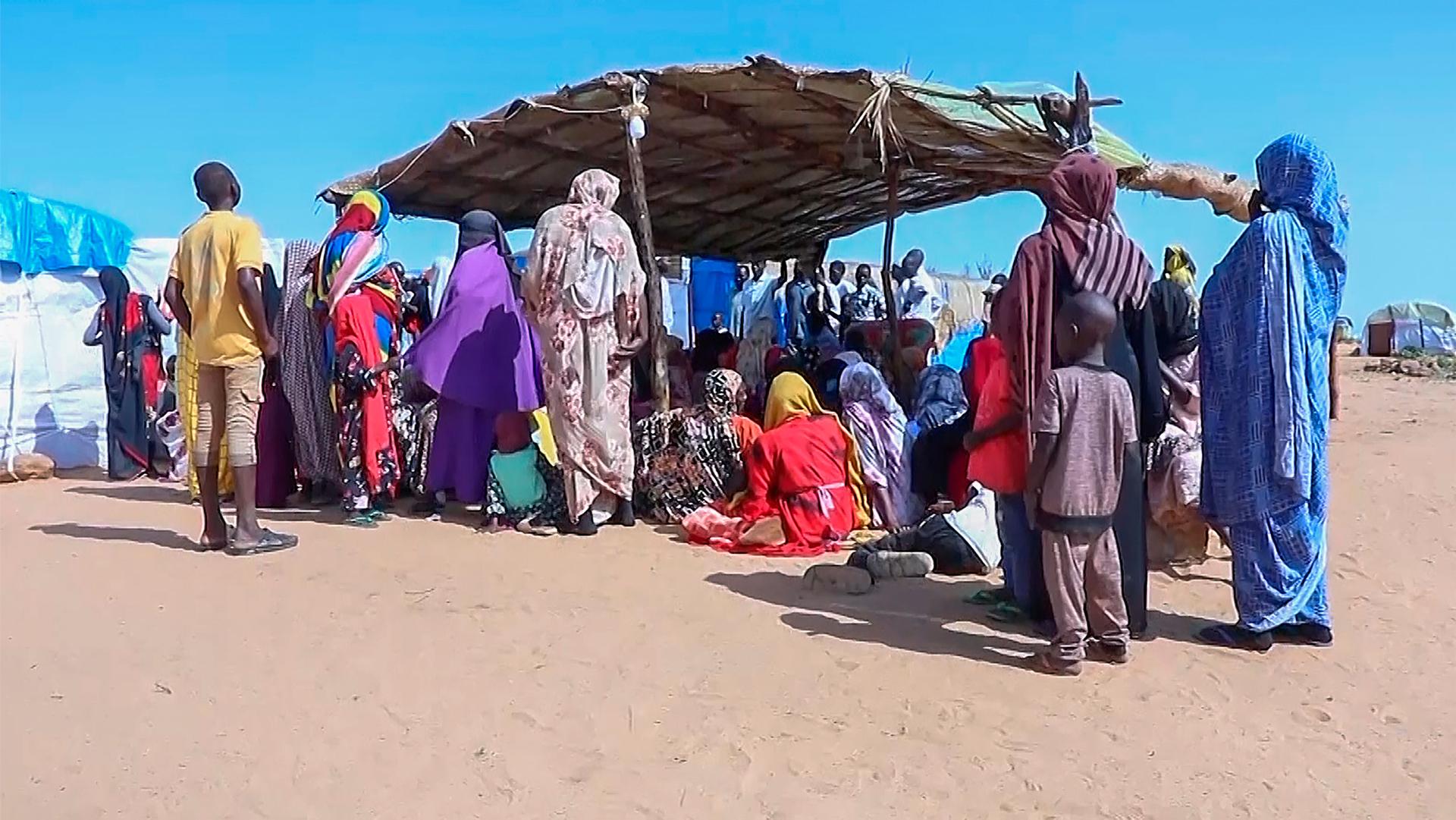 Sudanese refugees gather outside a field hospital in Acre, Chad, Aug. 15, 2023.