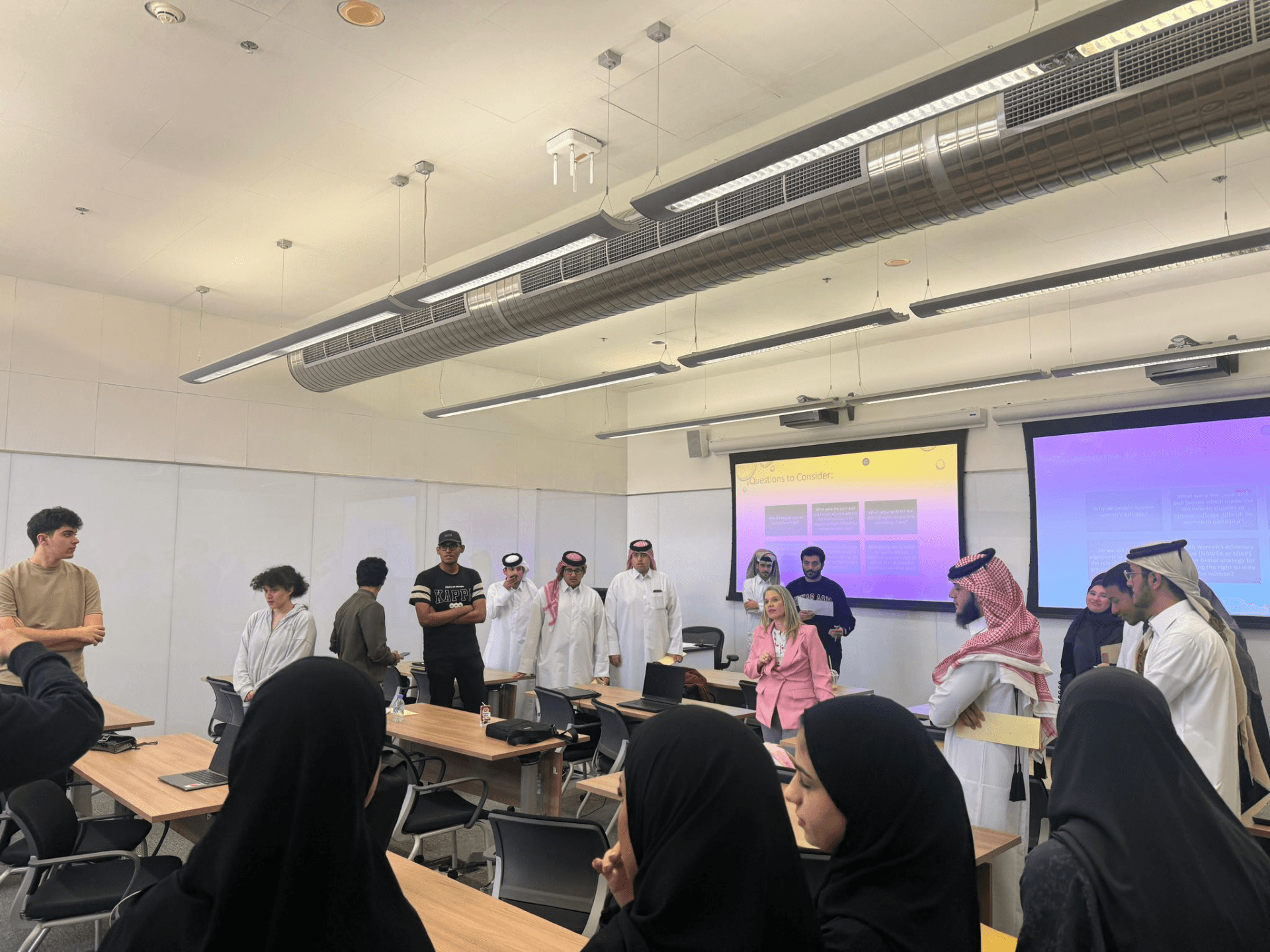 students gathered around a classroom