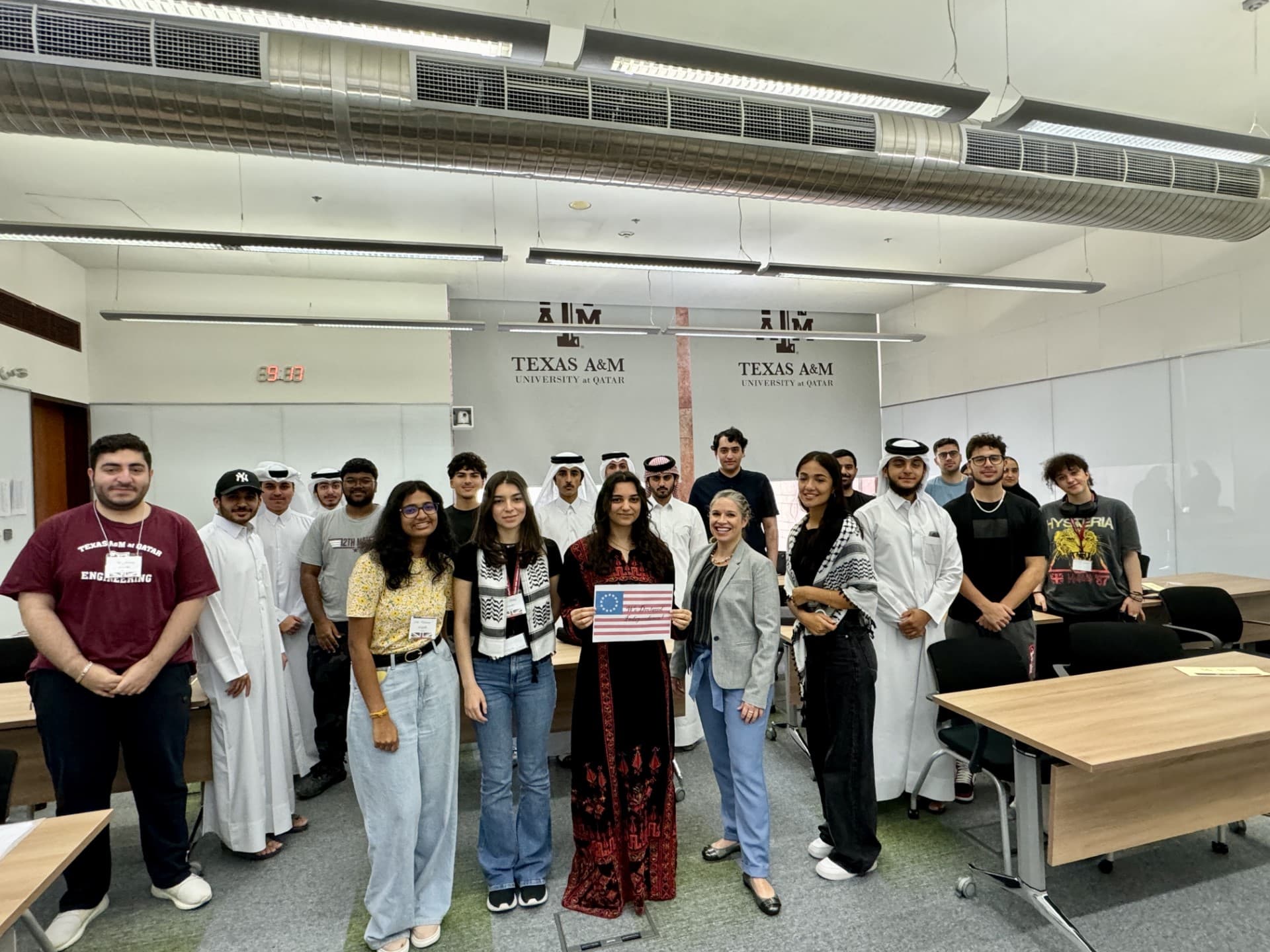 Students holding a paper flag