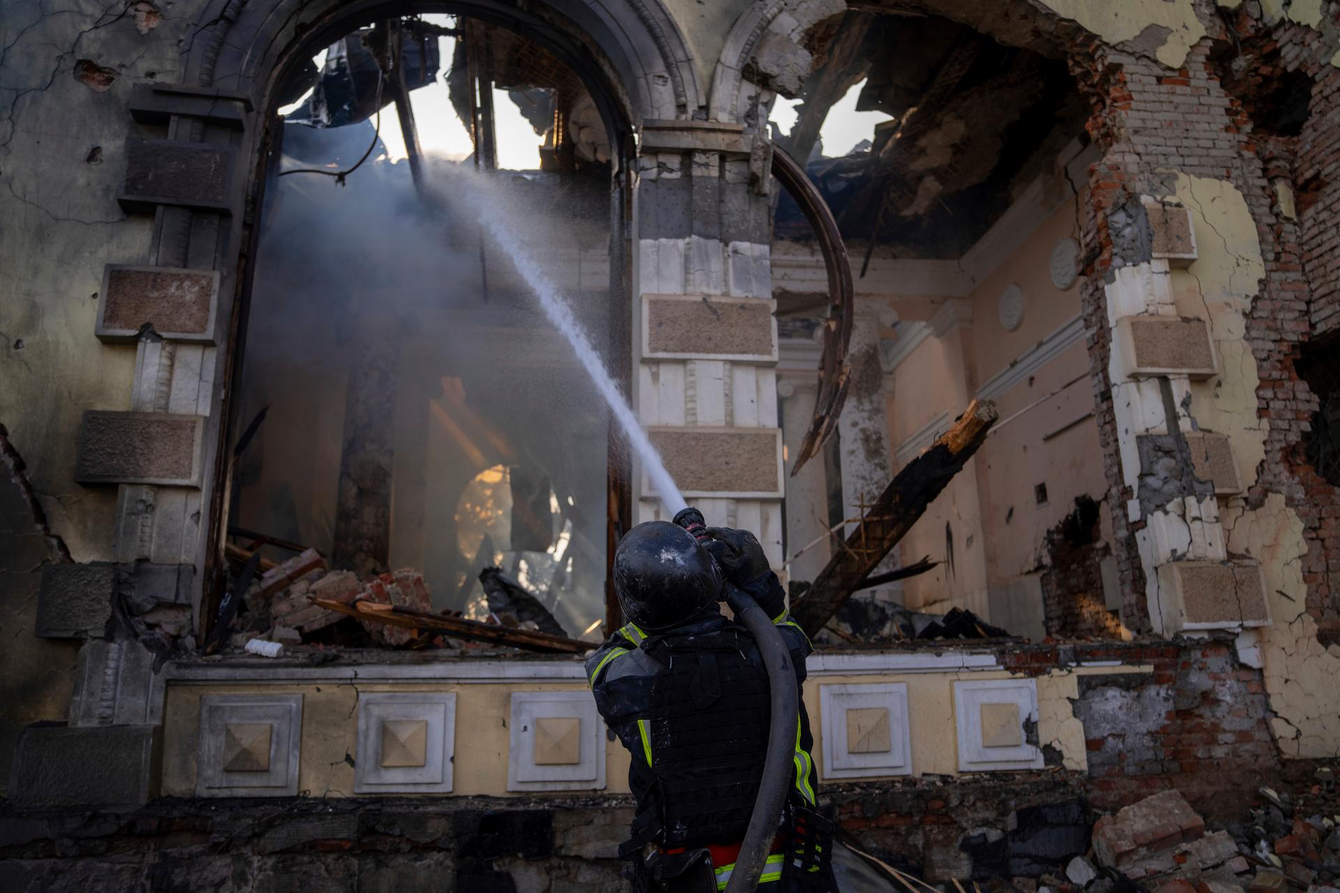 Firefighters put out the fire a railway station after Russians hit in Kostiantynivka, Donetsk region, Ukraine, Sunday, Feb. 25, 2024.