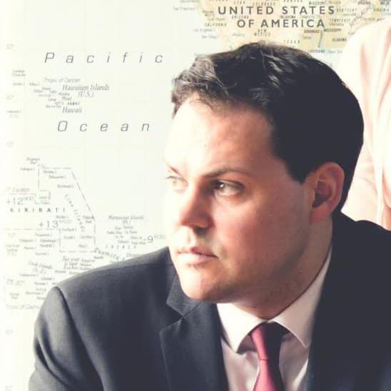 Man in front of map