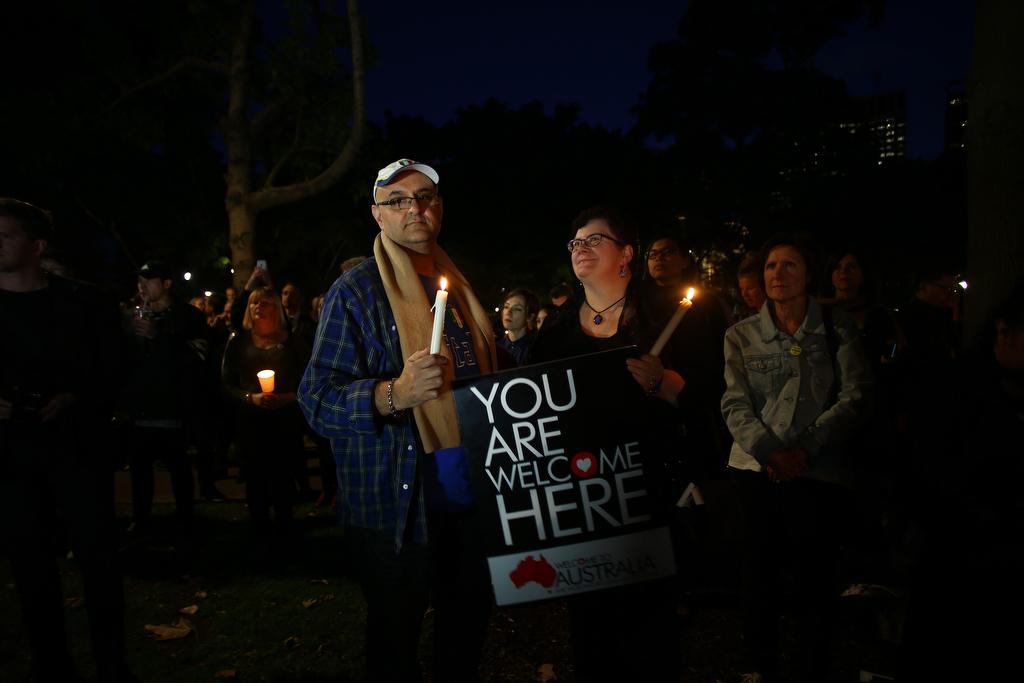People attend a candlelight vigil for refugees in Sydney on Sept. 7, 2015.