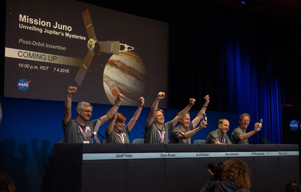 Members of the Juno team celebrate at a press conference after they received confirmation from the Juno spacecraft that it had completed the engine burn and successfully entered into orbit around Jupiter,at the Jet Propulsion Laboratory in Pasadena, Calif