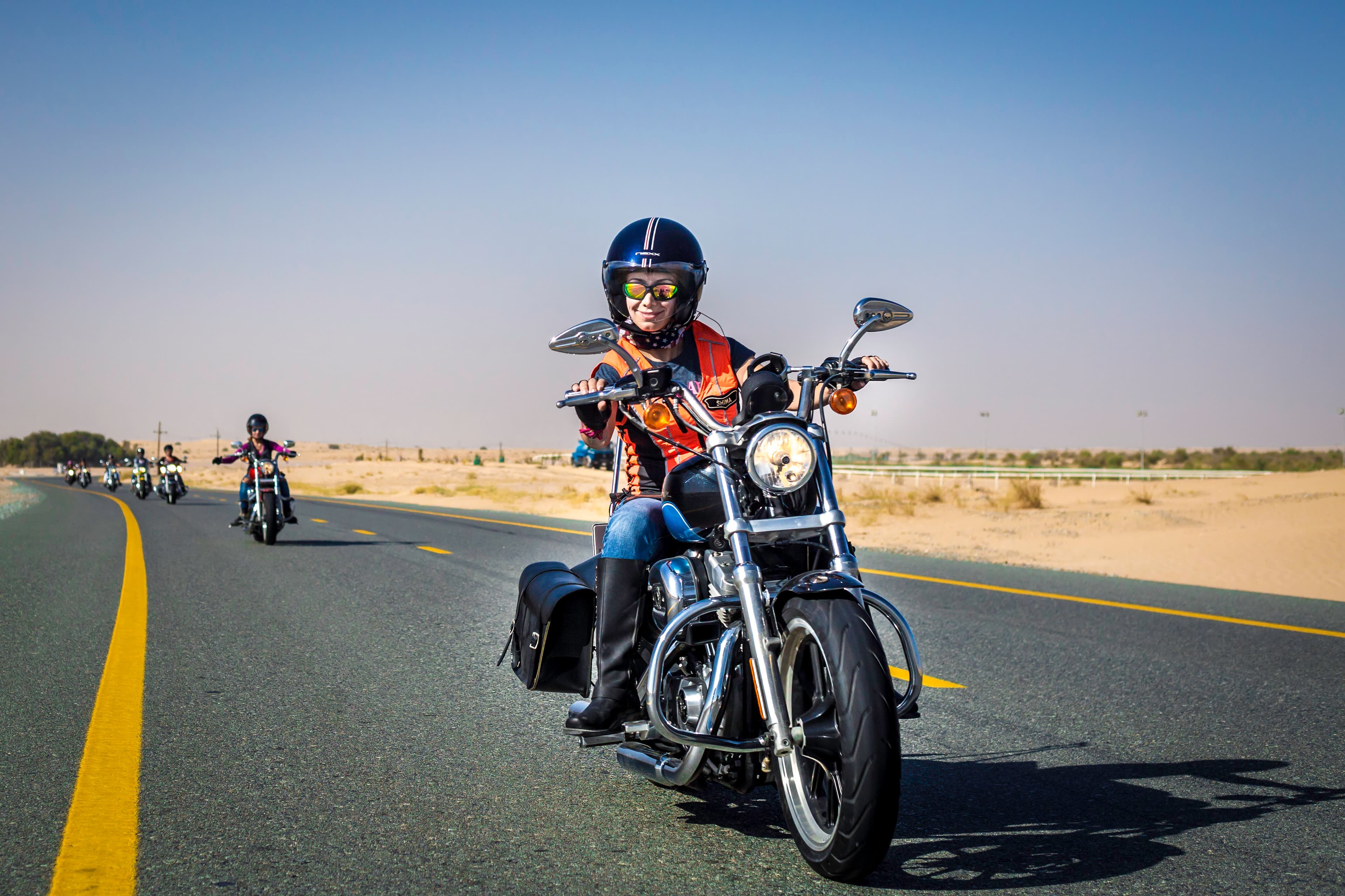 Shima Mehri leading the pack of Dubai Ladies of Harley riders on International Female Ride Day.