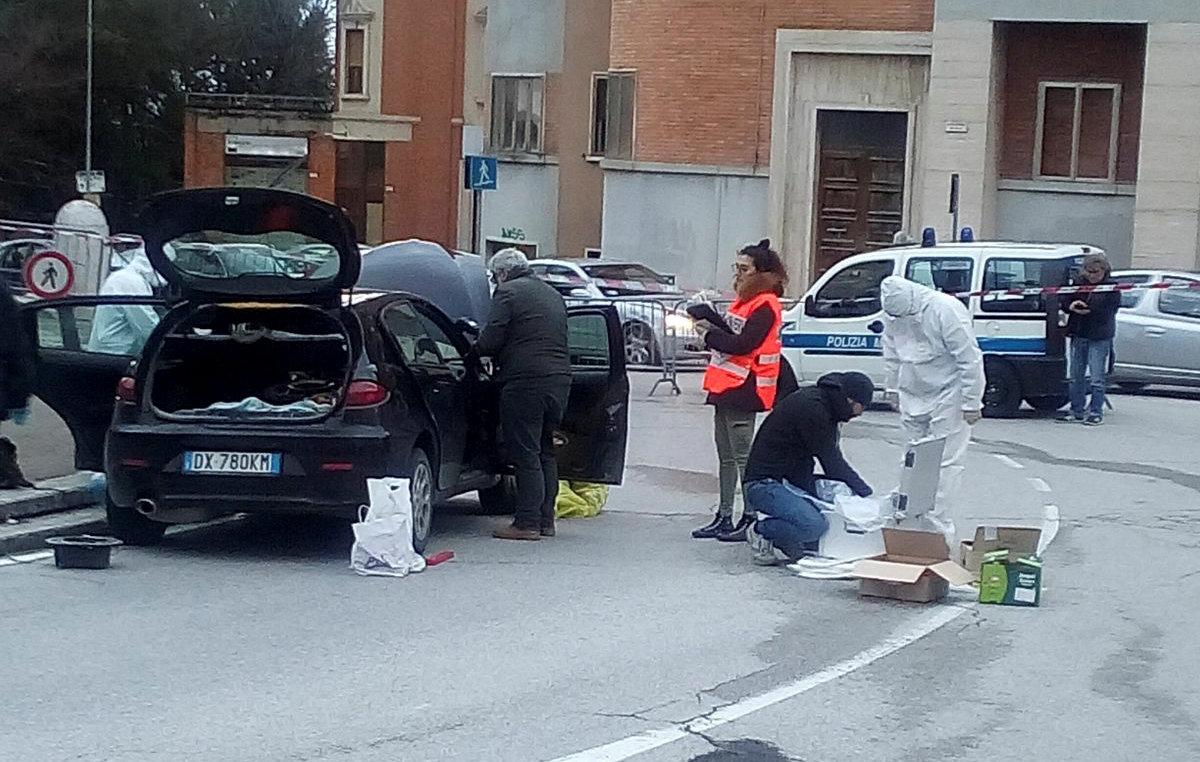 Forensics inspect a car used by a gunman in Macerata, Italy, Feb. 3, 2018.