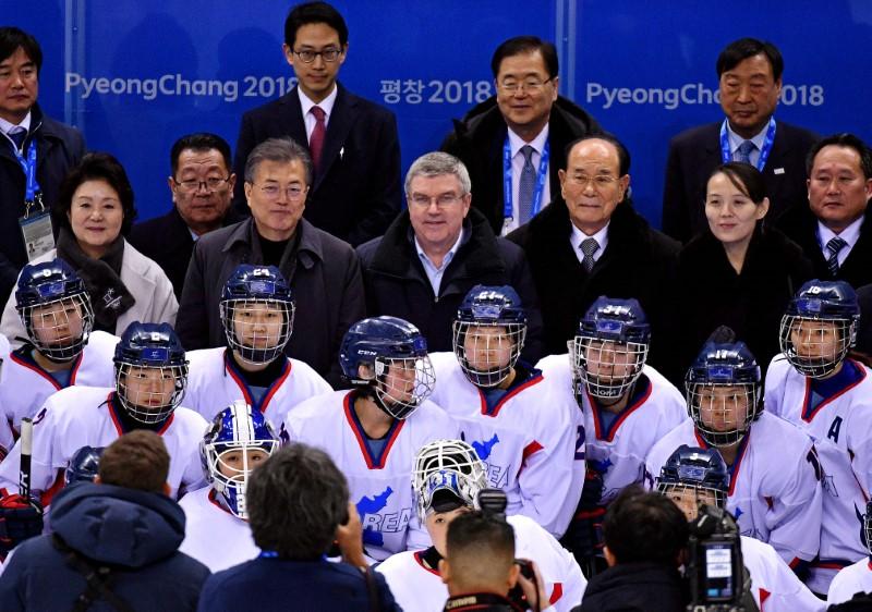 South Korea president Jae-in Moon; IOC president Thomas Bach; North Korea nominal head of state Kim Long-nam; and Kim Yo-jong, sister of North Korean leader Kim Jong-un with the Korean women's hockey team